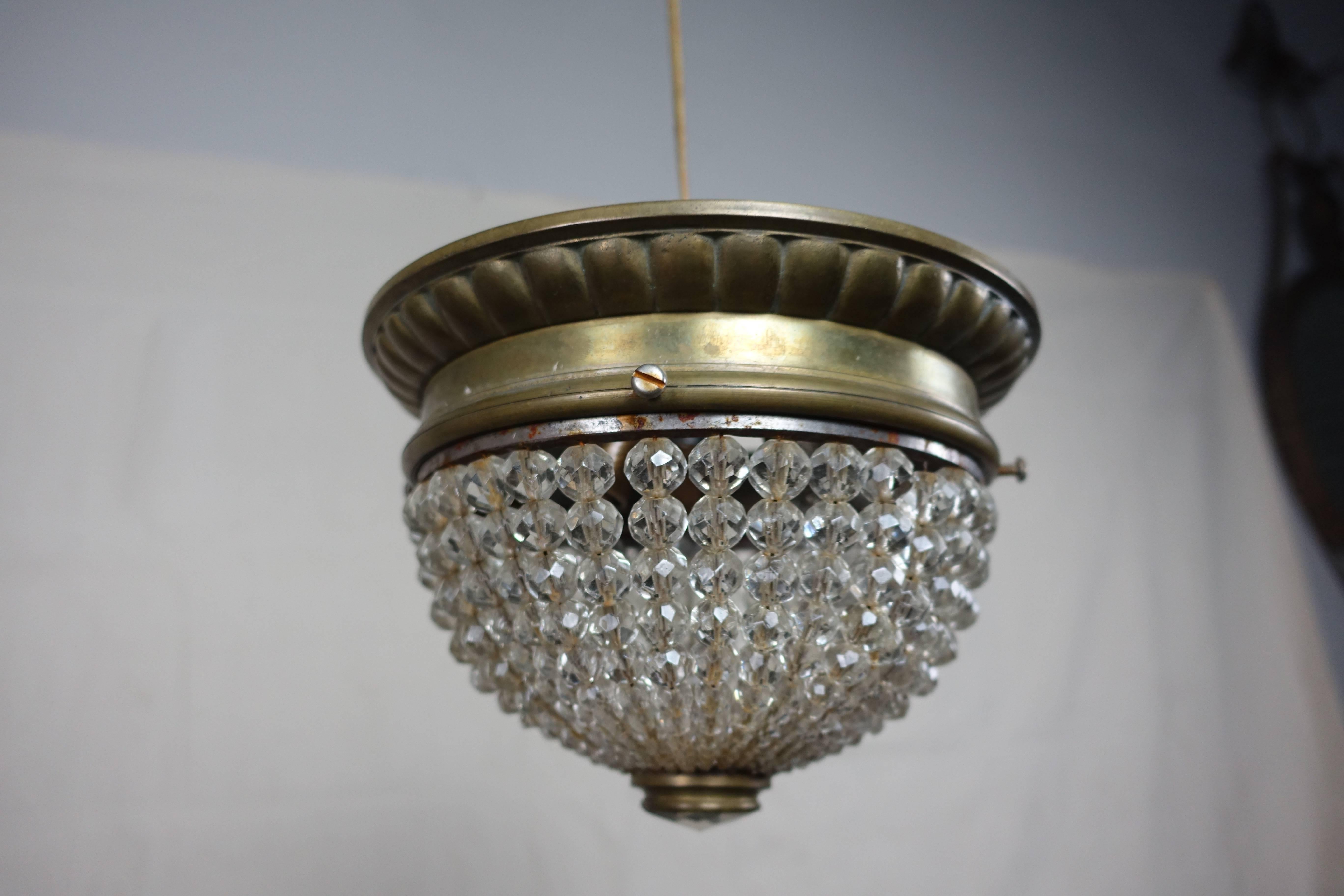 French crystal beaded ascending basket ceiling fixture with brass frame. Beautiful faceted crystal as bottom of light. Holds three candelabra size bulbs. Newly rewired and ready to install.