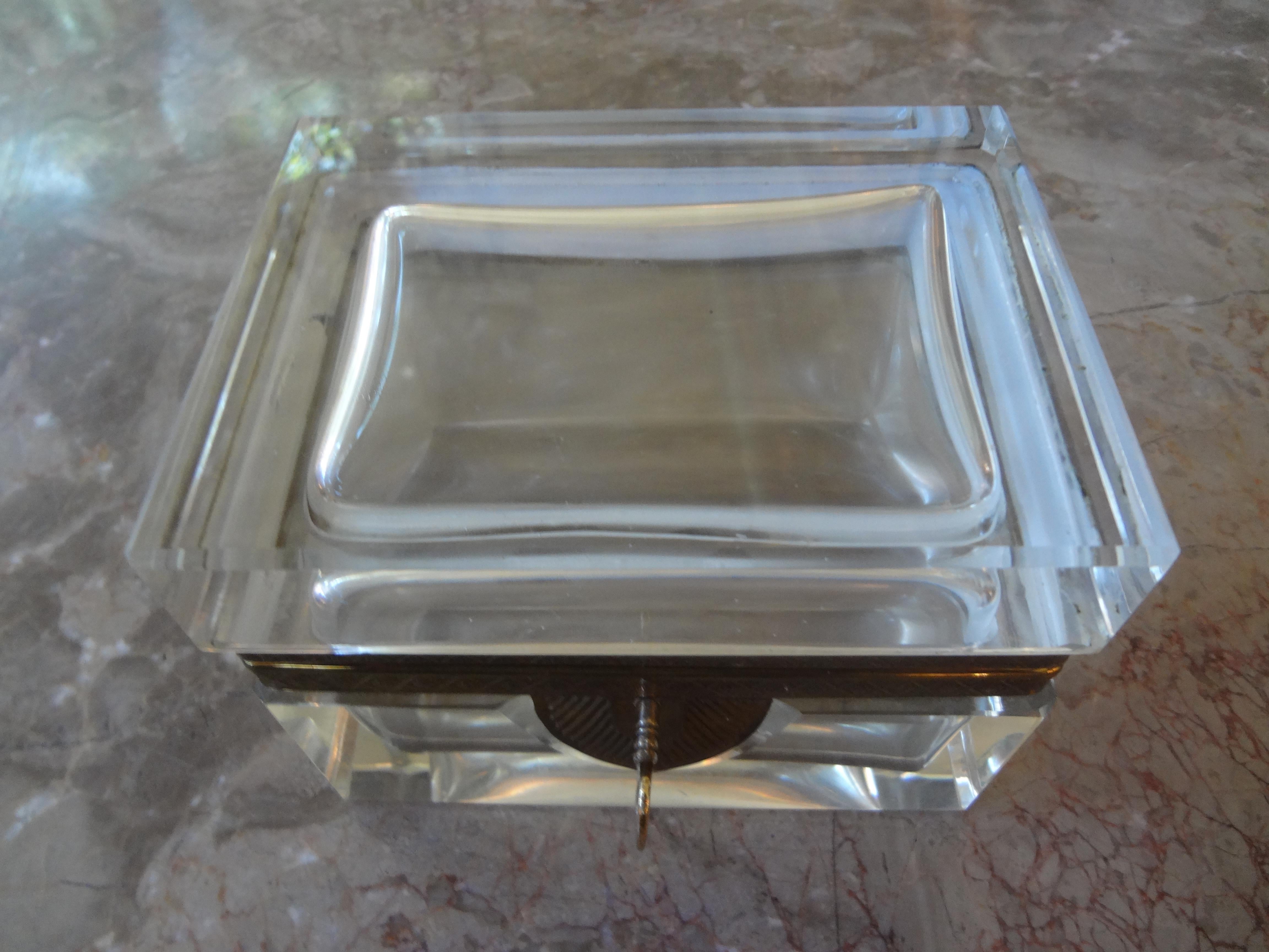 Stunning French crystal box with gilt metal fittings and key. This French crystal box was originally a jewel casket/jewelry box/vanity box/trinket box/Murano glass box. This French Baccarat style box would make a great decorative table accessory.
A