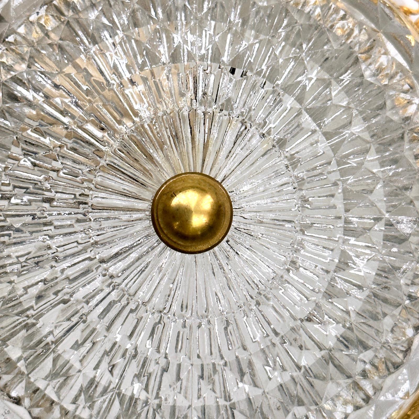 A circa 1950s French cut crystal light fixture with 1 interior lights.

Measurements:
Drop: 3