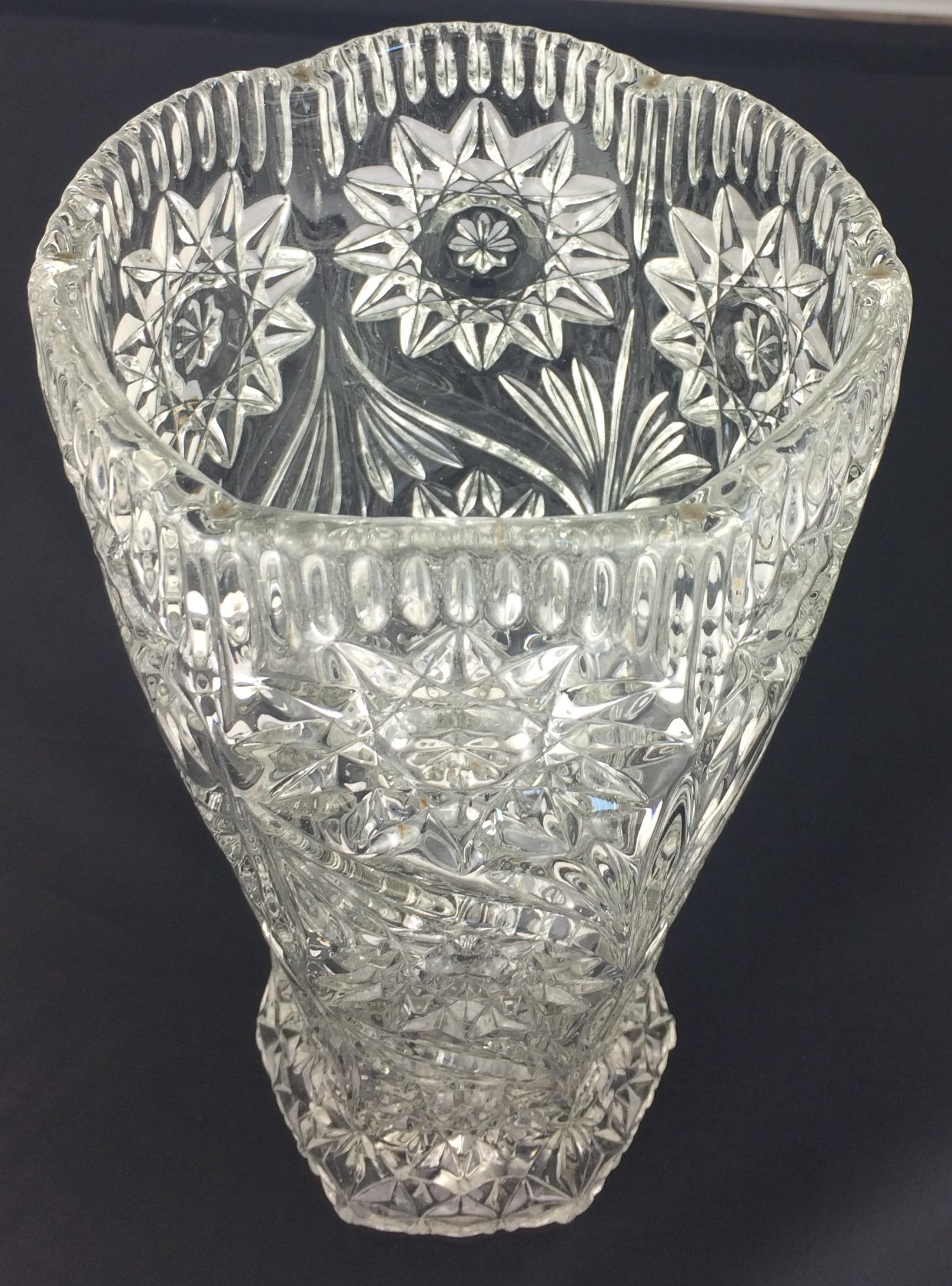 A wonderful piece made of very good quality vase. The design is typical of French art glass from the early 20th Century made by Baccarat, although, this one is not signed. 

Perfect condition. No chips nor cracks. Makes a great centerpiece and gift.