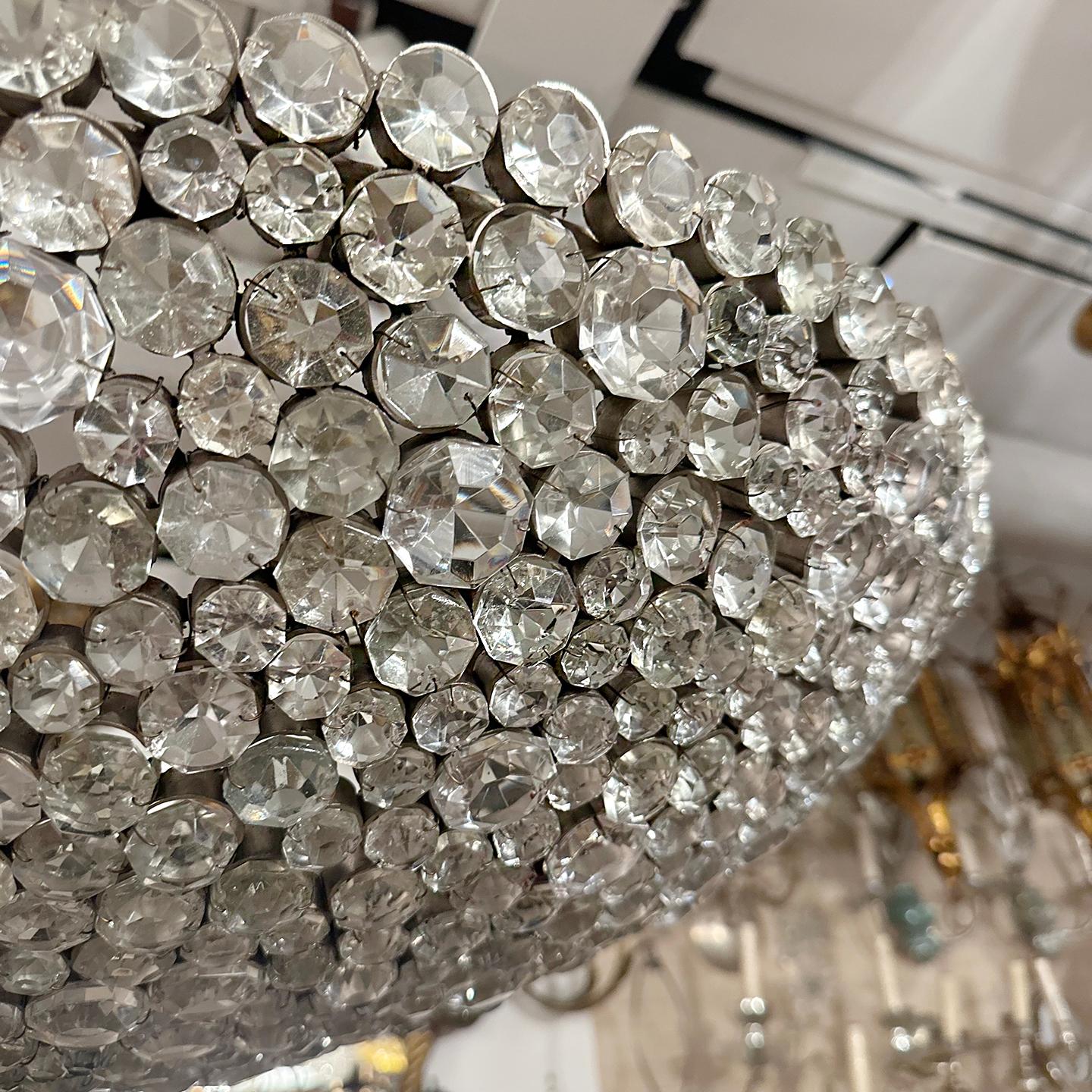 Circa 1960's French oval nickel plated light fixture with crystal insets on the body. 8 Edison interior lights.

Measurements:
Present drop: 24.5
