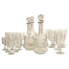Set di 18 bicchieri e 4 decanter in cristallo francese, XIX secolo