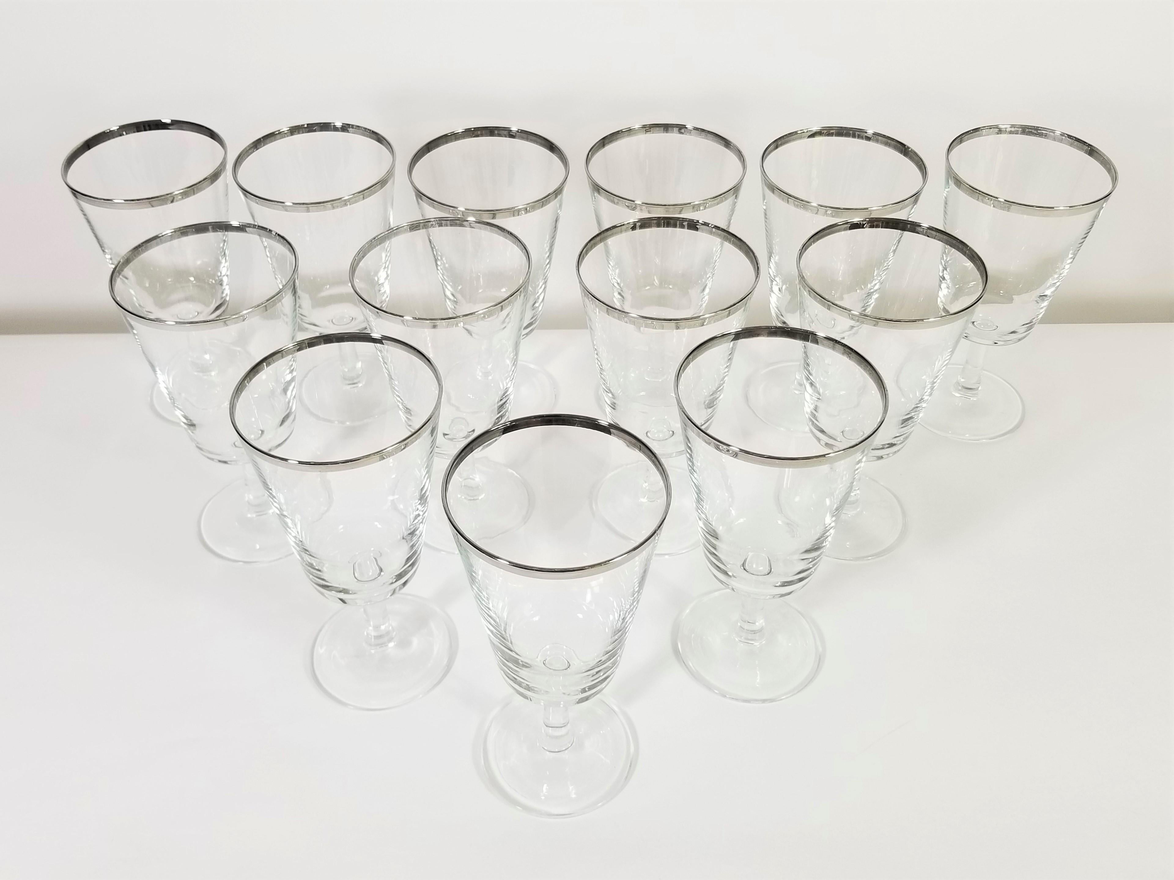 Elegant midcentury crystal stemware/ goblets. Silver rimmed. Made in France. All glasses marked France on bottom. 13 glasses. Excellent condition.