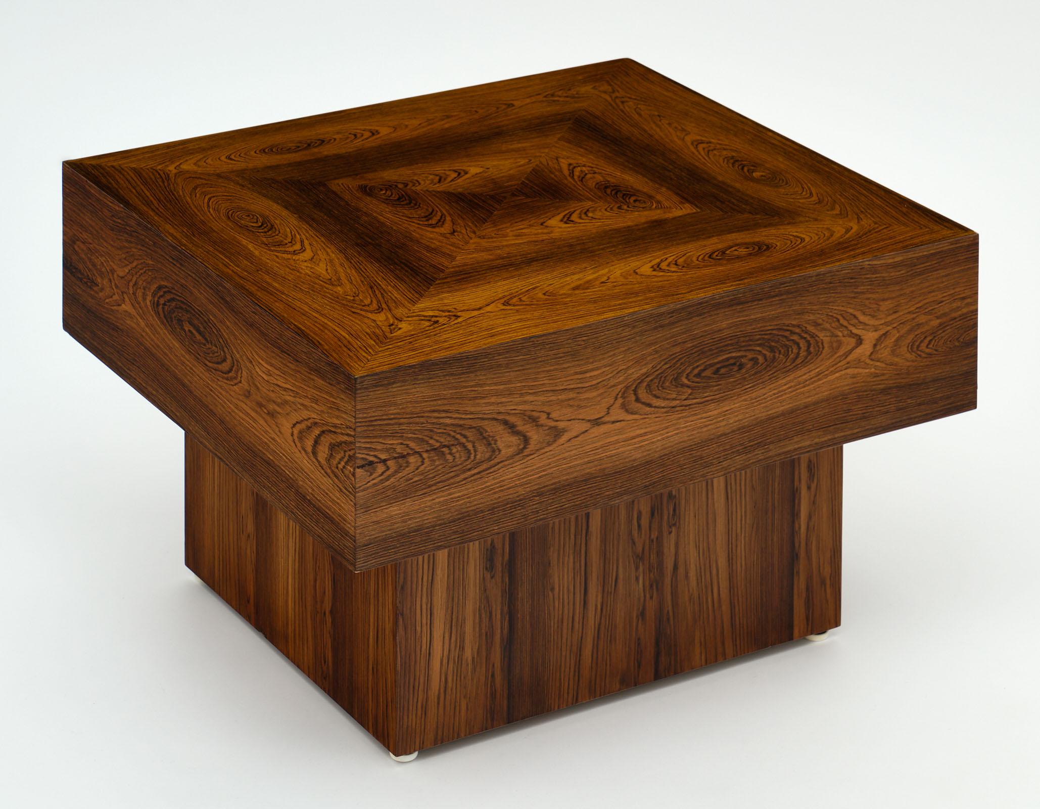 A unique cubist French wood side table made of Brazilian rosewood veneer with clean lines and a very modernist flair. We love the warmth of this piece!