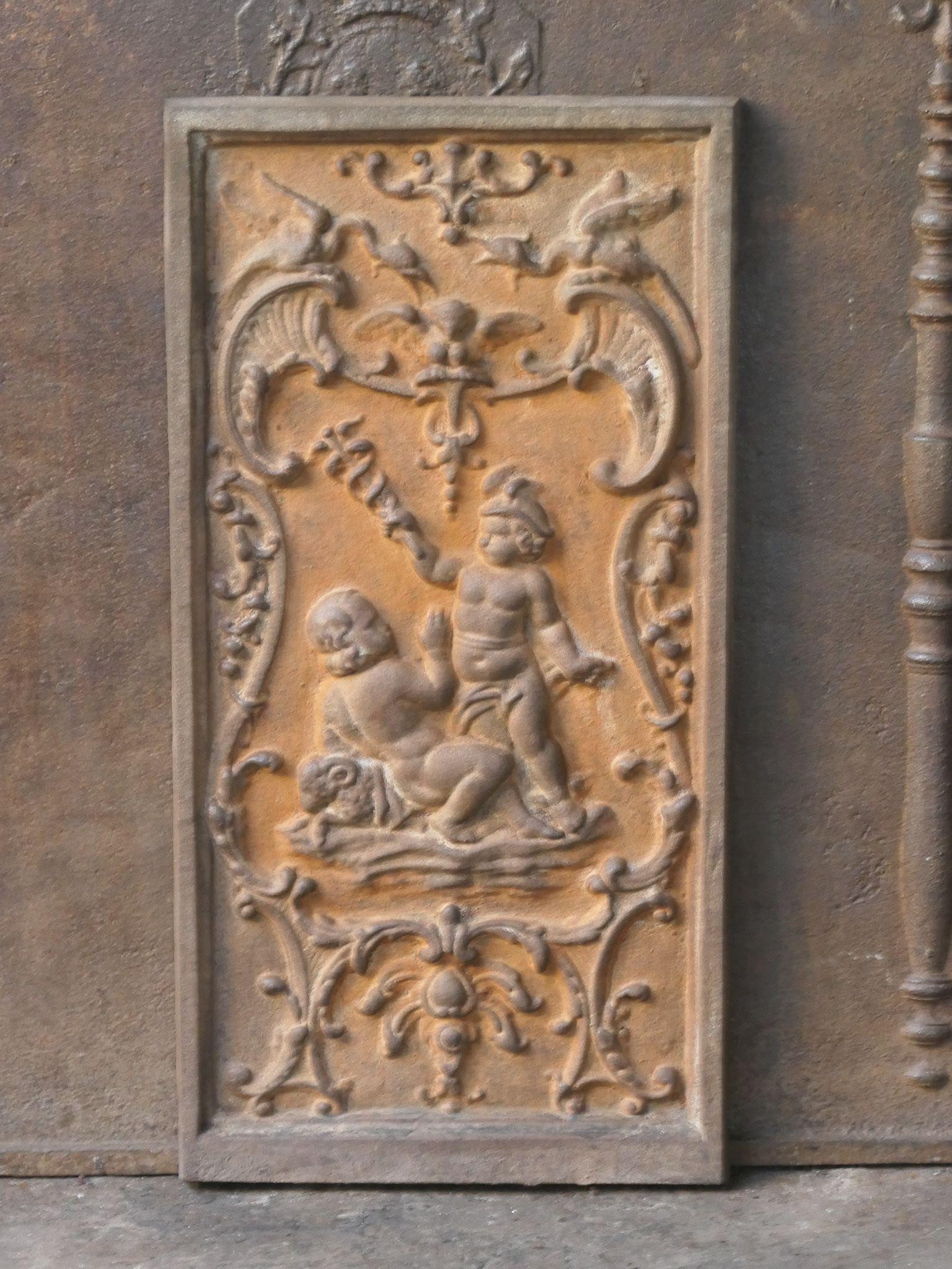 20th century French fireback with cupids. Louis XV Style. The fireback is made of cast iron and has a natural brown patina. Upon request, it can be made black/pewter at no extra cost. The fireback is in good condition and does not have cracks.