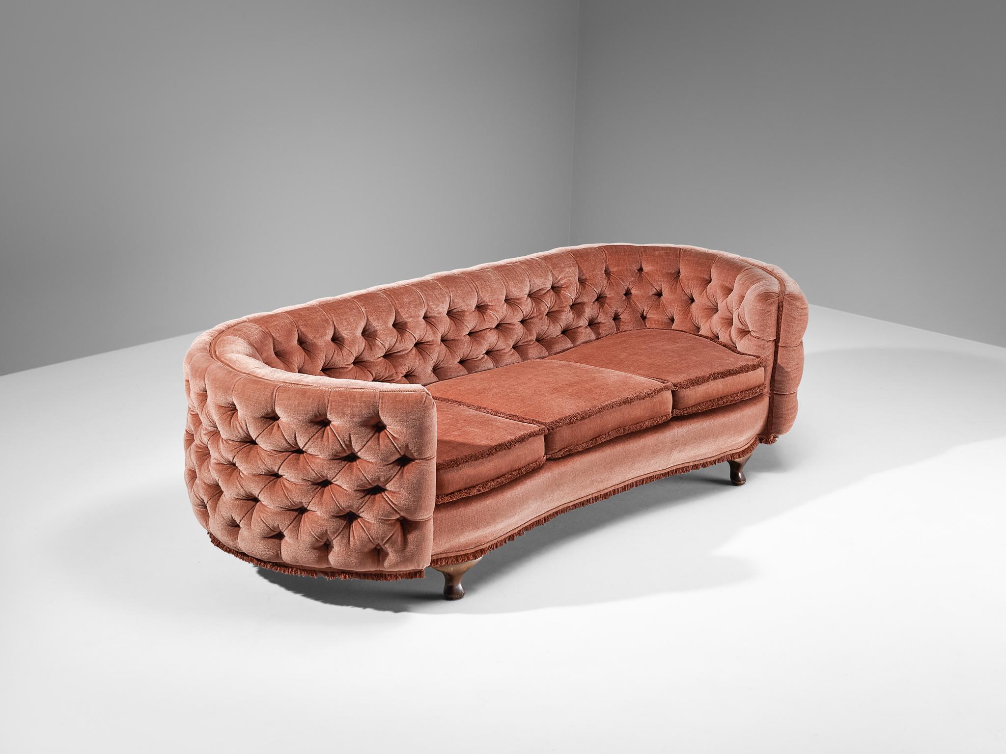 Sofa, mohair, stained beech, France, 1960s

This baroque-inspired sofa of French origin features a a voluptuous body with delicate lines and decorative accents. The luxurious and chic appearance of the sofa is achieved through the use of soft pink