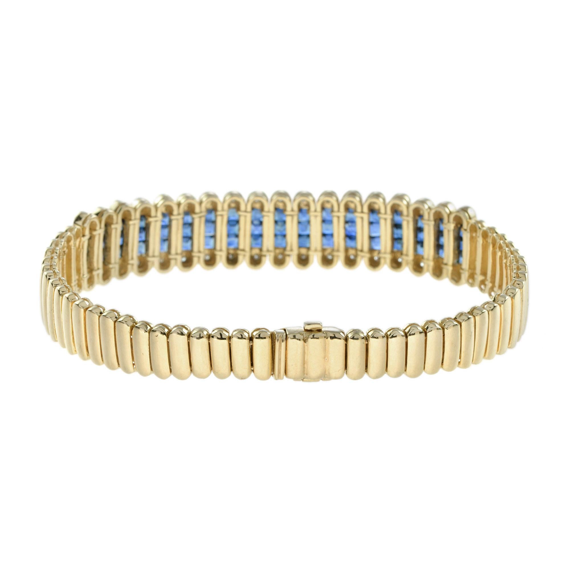 This elegant, Art Deco inspired bracelet is simply magnificent as it features 54 French cut blue sapphires and 36 diamonds in 18k yellow gold. Renowned for their allure and ranges of blues; sapphires are considered a symbol of love, loyalty, and