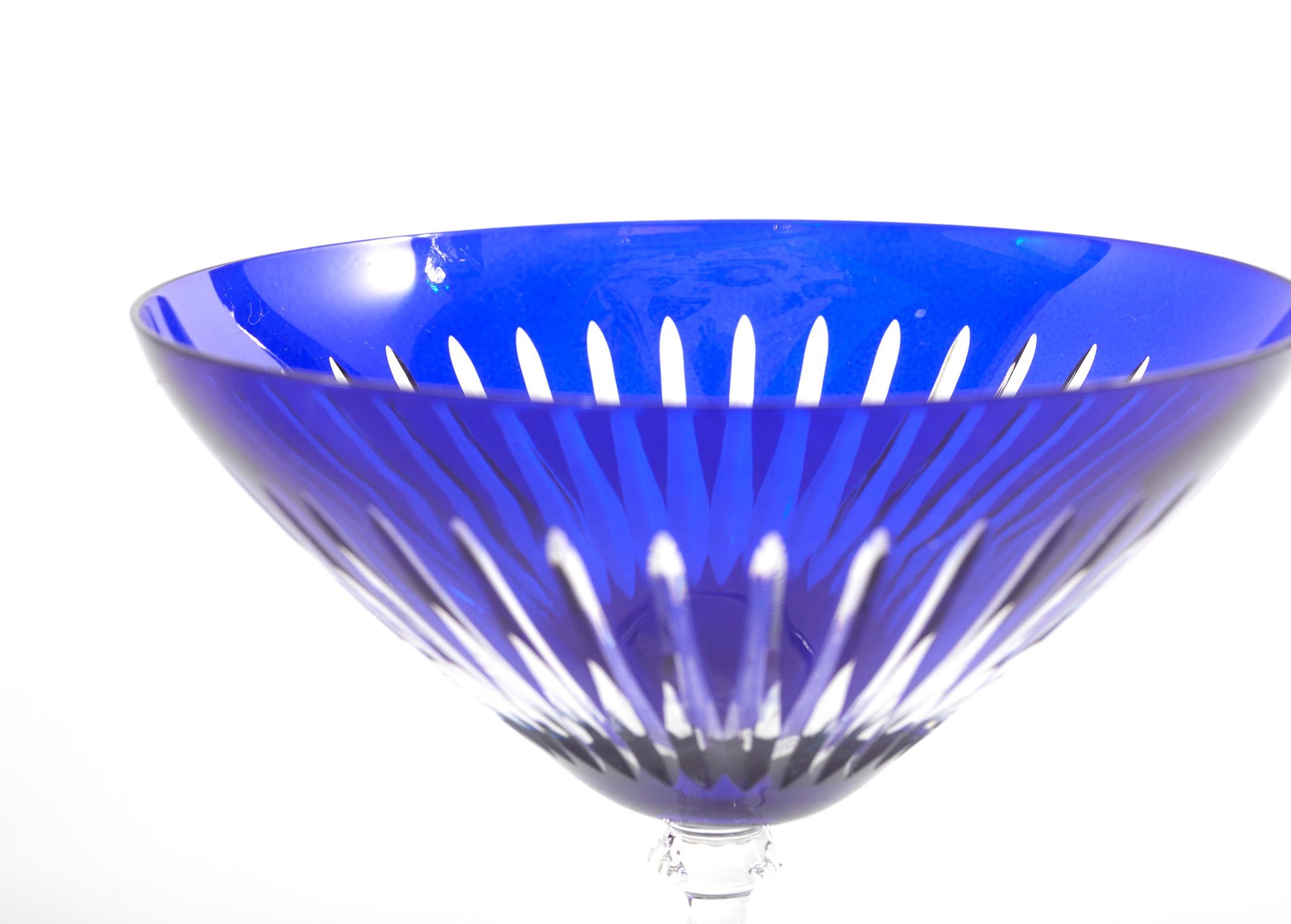 Late 20th century France cut crystal Cobalt blue with clear stem barware / tableware martini service for 11 people. Each glass is in great condition. Minor wear. Each one stands about 6.5 inches tall x 5 inches diameter.
