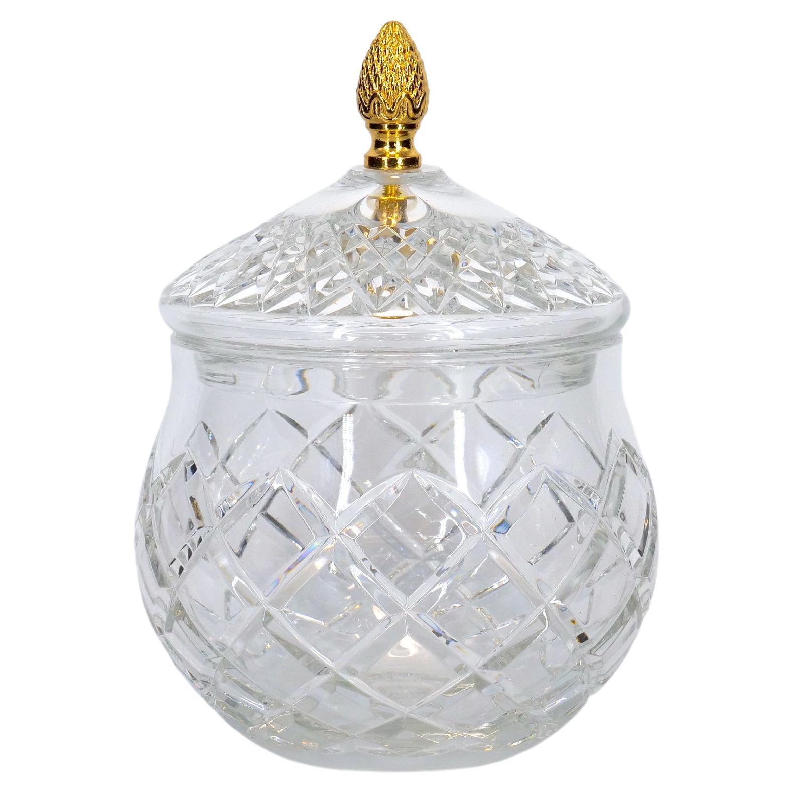 Late 20th Century french cut crystal tableware covered serving piece. The piece features a diamond shape cut crystal details and gilt top brass pinecone finial covers resting on a round base. The piece is in great condition. Maker's mark undersigned