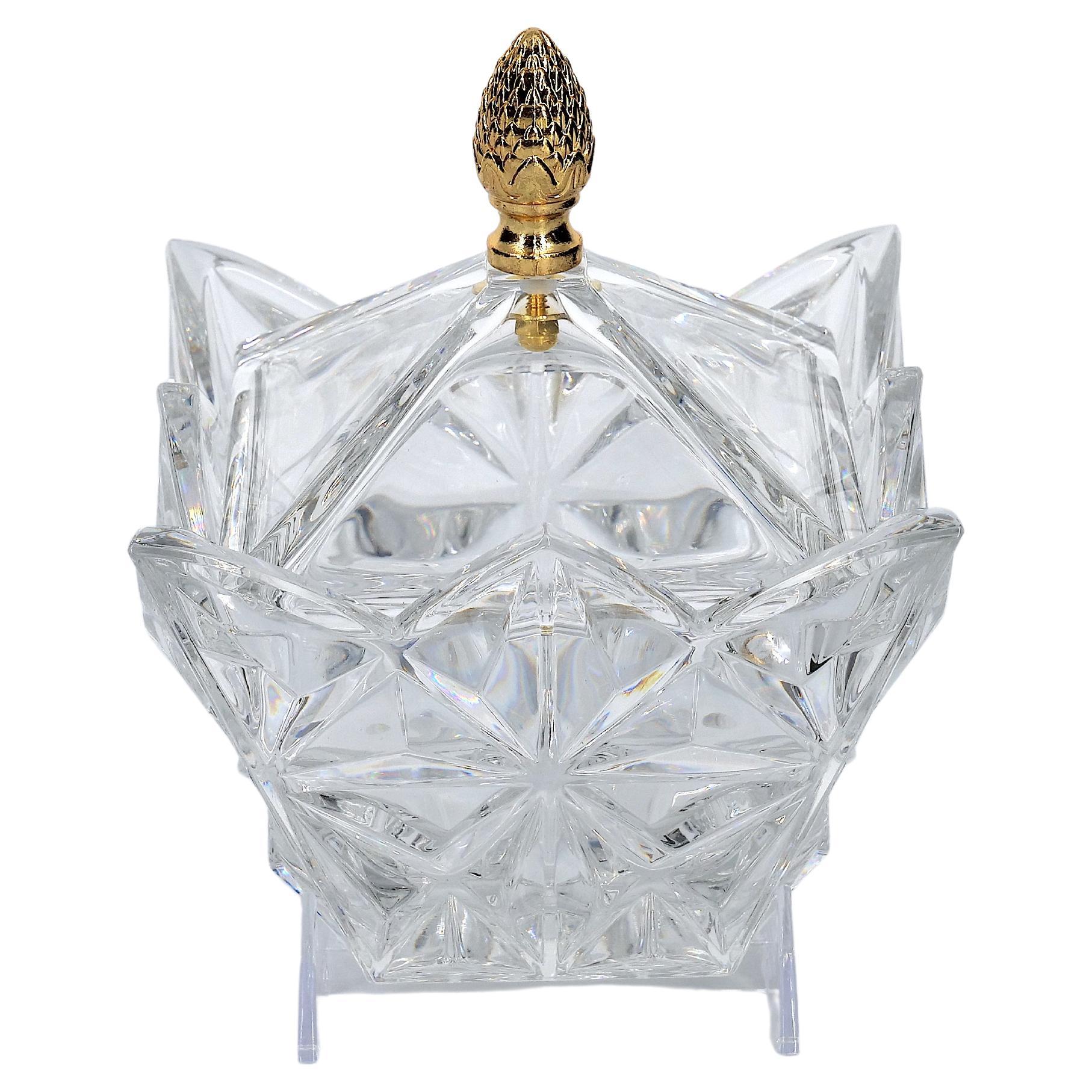 Late 20th century cut crystal tableware covered serving piece. The piece features a gilt top brass pinecone finial covers resting on a squared shape base with exterior cut crystal diamond shape design details. The piece is in great condition. Minor