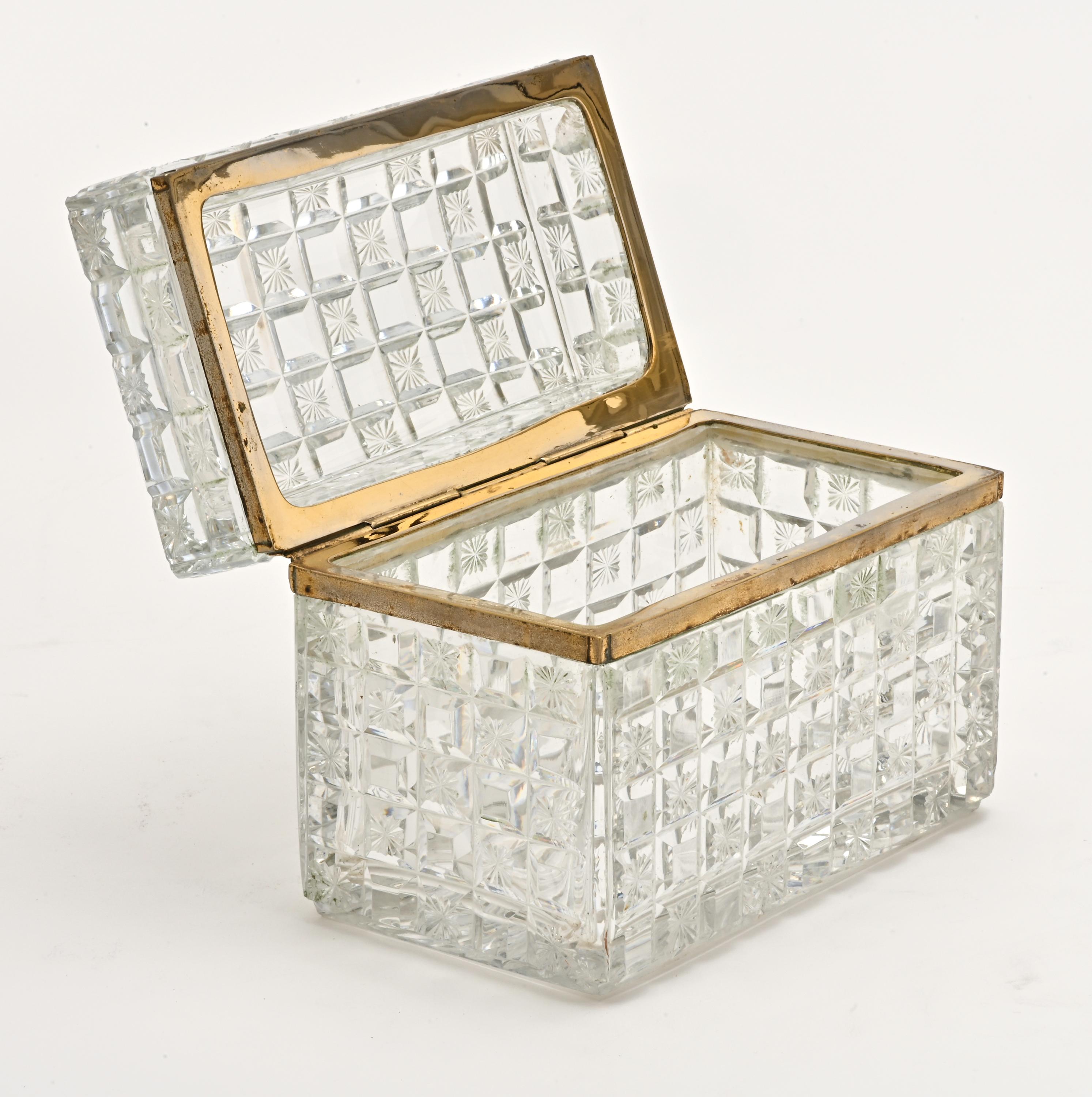 French, circa 1910. Beautiful cut crystal box, faceted on all sides with bronze gilt hinge and trim.
Wonderful for jewelries or decorative accent.   
  