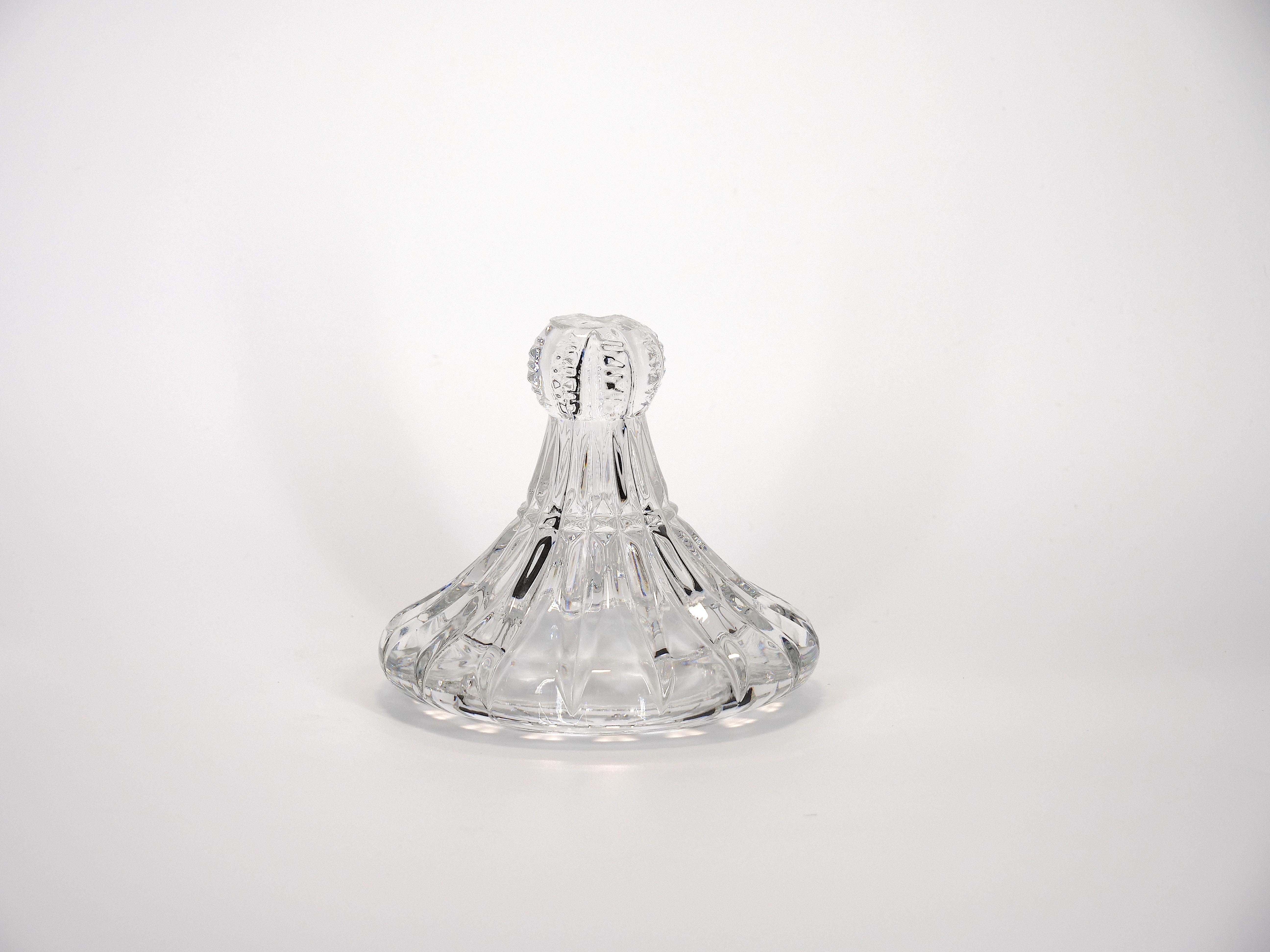French cut crystal tall covered decorative piece / urn. The piece features and exterior cut crystal design details resting on a round form pedestal base. The piece is in great condition. Minor wear/ roughness to the covered top. Maker's mark
