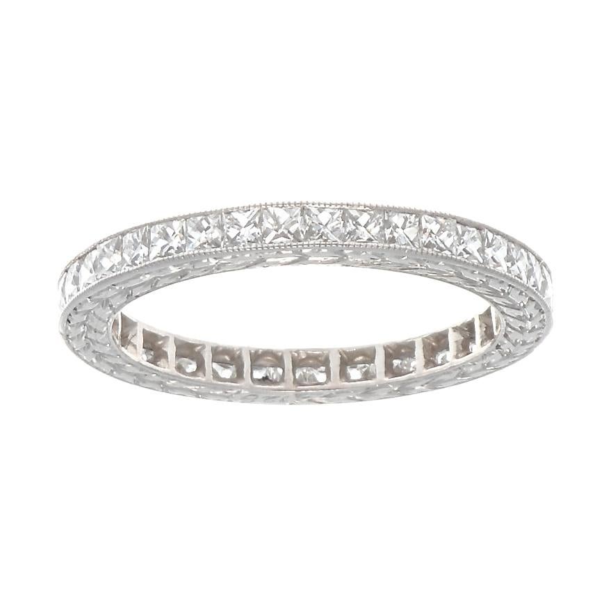 Modern diamond platinum eternity band. With 26 French cut diamonds weighing 1.28 carats graded G-H color, VS clarity. Circa 2000. Size 6 1/2. 