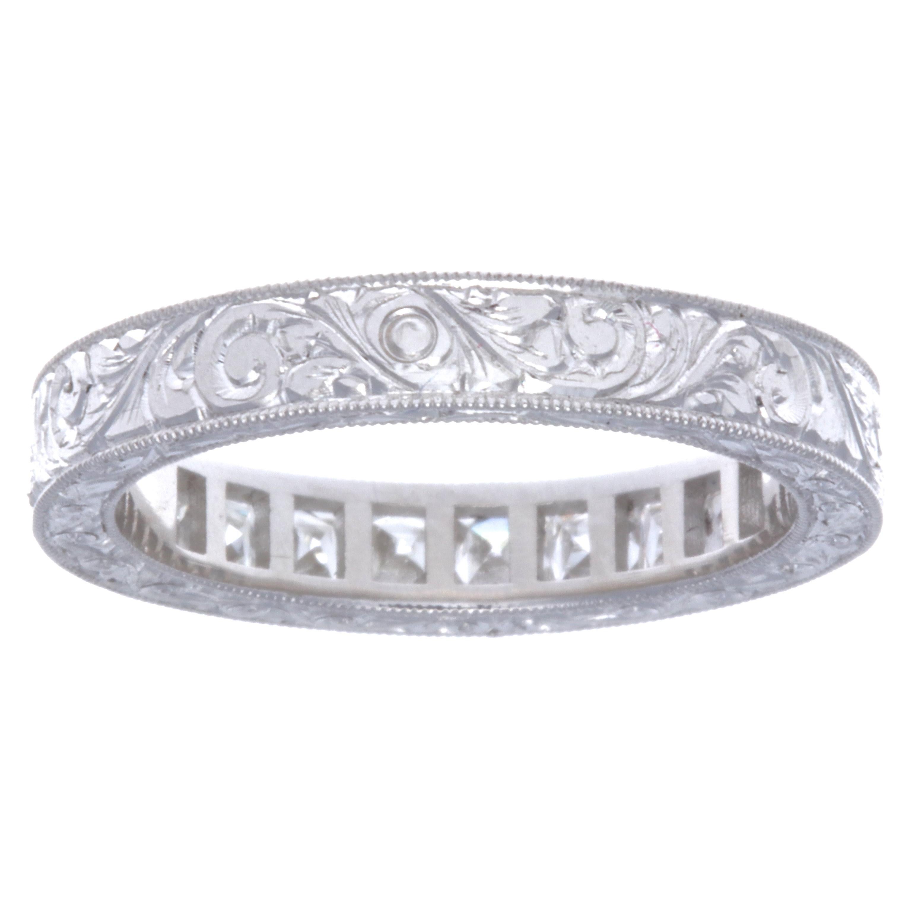 If you are looking for an eternity band, and would like to save some money, this diamond platinum half eternity band would be your best choice! The Art Deco revival finely filigreed  ring features 9 French cut diamonds weighing approximately 0.90