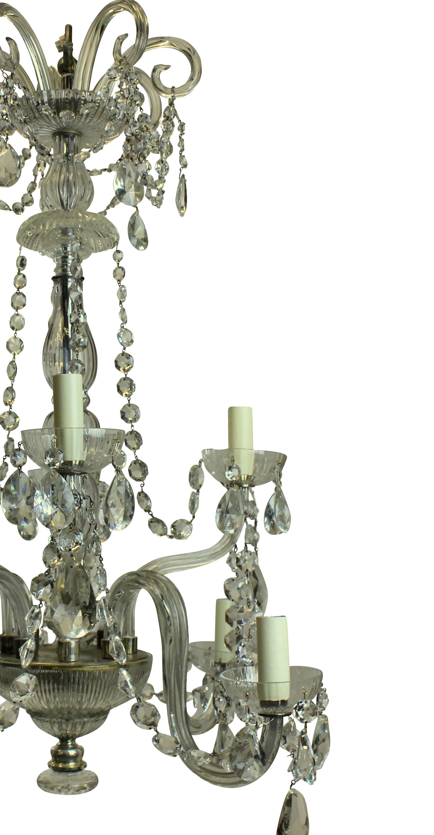 A French cut-glass chandelier of good proportions, with scrolls and swags.