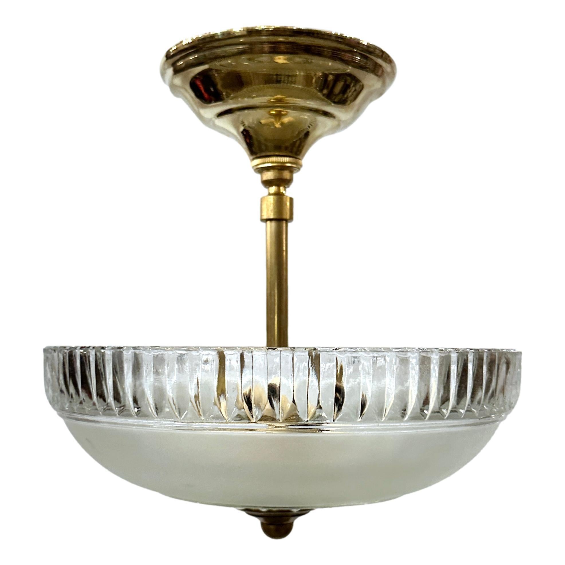 A circa 1920's French cut glass pendant light fixture with three lights.

Measurements:
Drop: 10