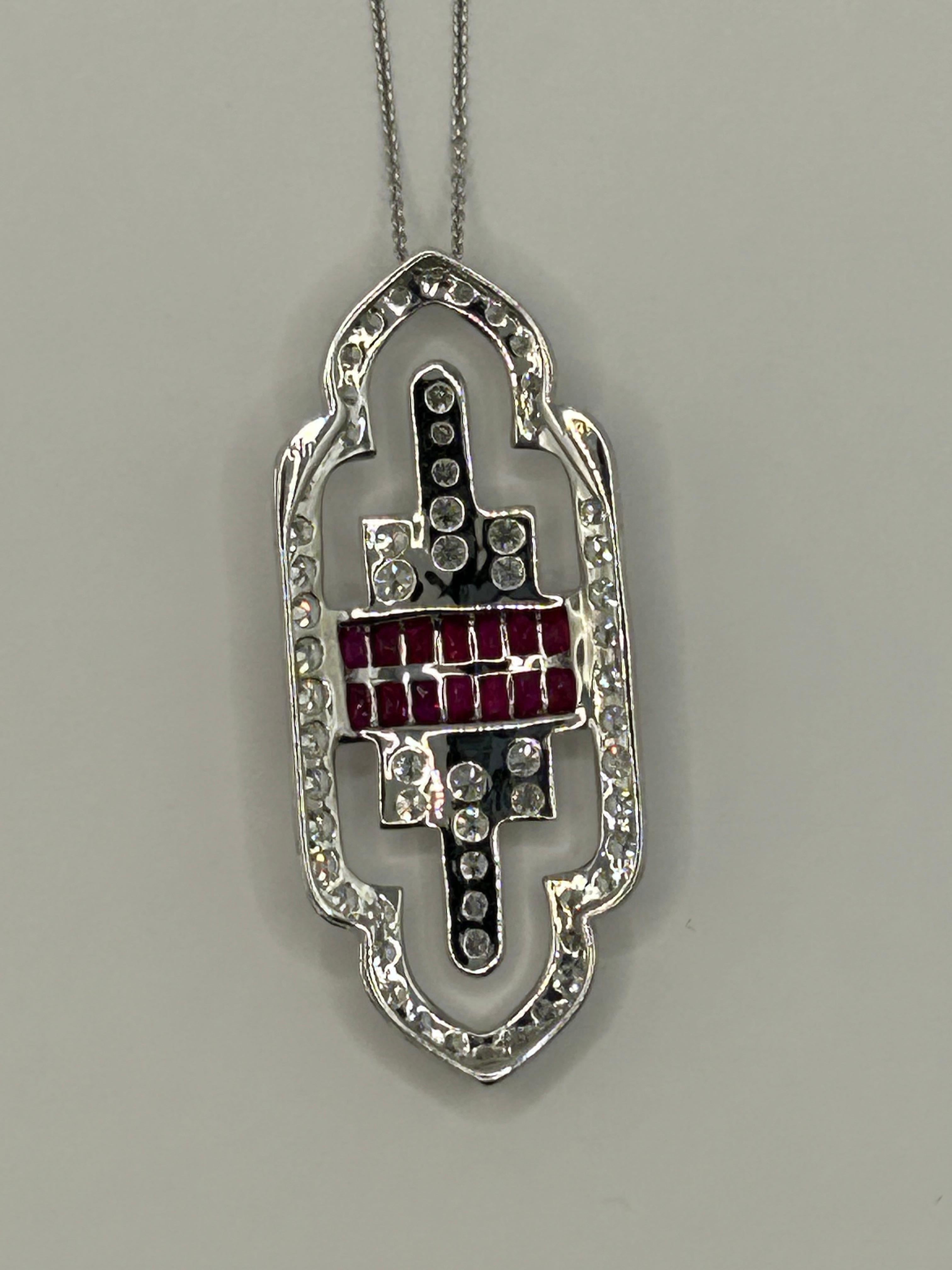 Vintage inspired Art Deco style 18 Karat White Gold Pendant set with 2.05 Carat Fine Quality French Cut Ruby and Round Brilliant Cut Diamonds of 2.48 Carat Total Weight.  Average Diamond Clarity is VS and Color is G.
Pendant is strung with 18 Karat