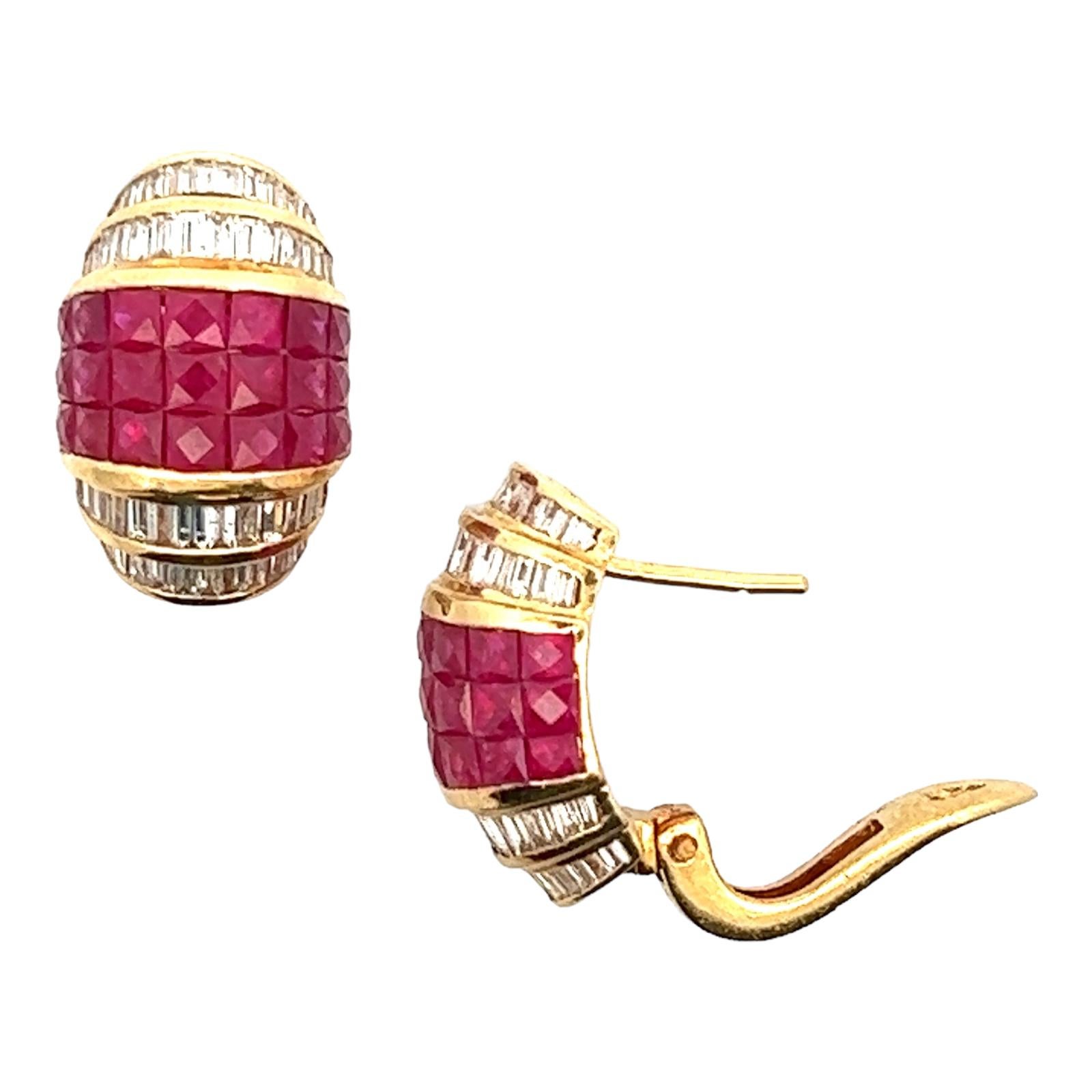 Diamond and ruby earrings fashioned in 18 karat yellow gold. The earrings feature 108 baguette cut diamonds weighing approximately 2.00 CTW and 42 French cut ruby gemstones weighing approximately 6.00 CTW. The diamonds are graded H-I color and SI1