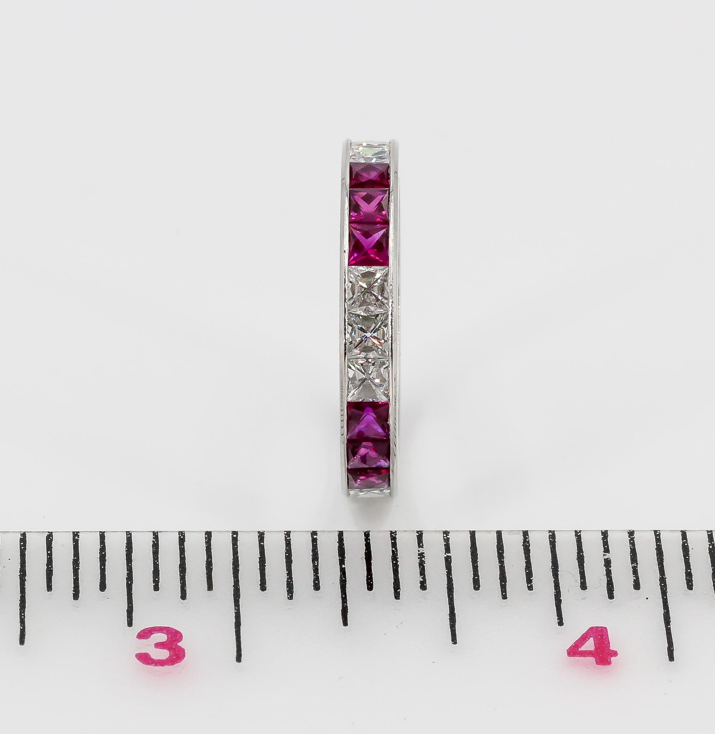 Very fine French cut ruby, diamond and platinum band. It features apprx. 1.60 carats of rich red rubies and approx. 1.3 carats of high grade princess cut diamonds. Size US 6.

Hallmarks: 950. 