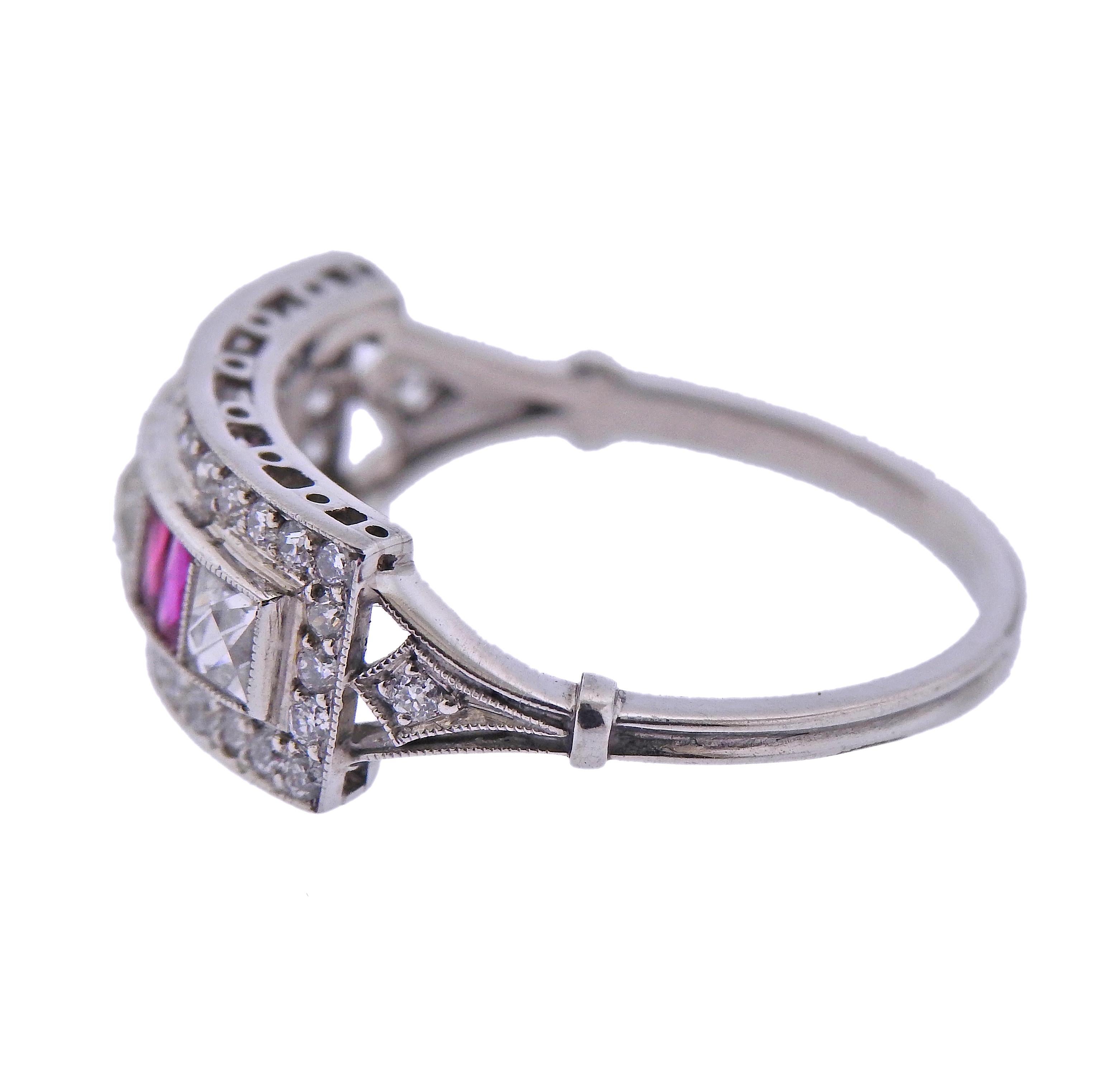 Platinum ring, with French cut rubies and diamonds, surrounded with round diamonds. Total diamonds approx. 0.54ctw. Ring size - 7.5, ring top is 7.5mm wide. Weight - 3.8 grams.