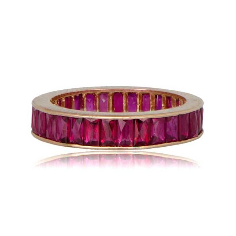 A stunning ruby and gold wedding band featuring French-cut rubies channel-set around the entire band. This eternity band elegantly combines the brilliance of French-cut rubies with the warmth of gold for a timeless and vibrant design.
This wedding