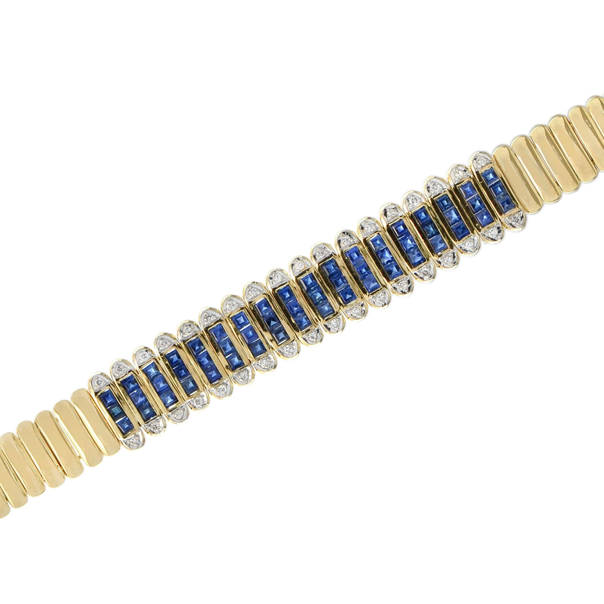 This elegant, Art Deco inspired bracelet is simply magnificent as it features 54 French cut blue sapphires and 36 diamonds in 18k yellow gold. Renowned for their allure and ranges of blues; sapphires are considered a symbol of love, loyalty, and
