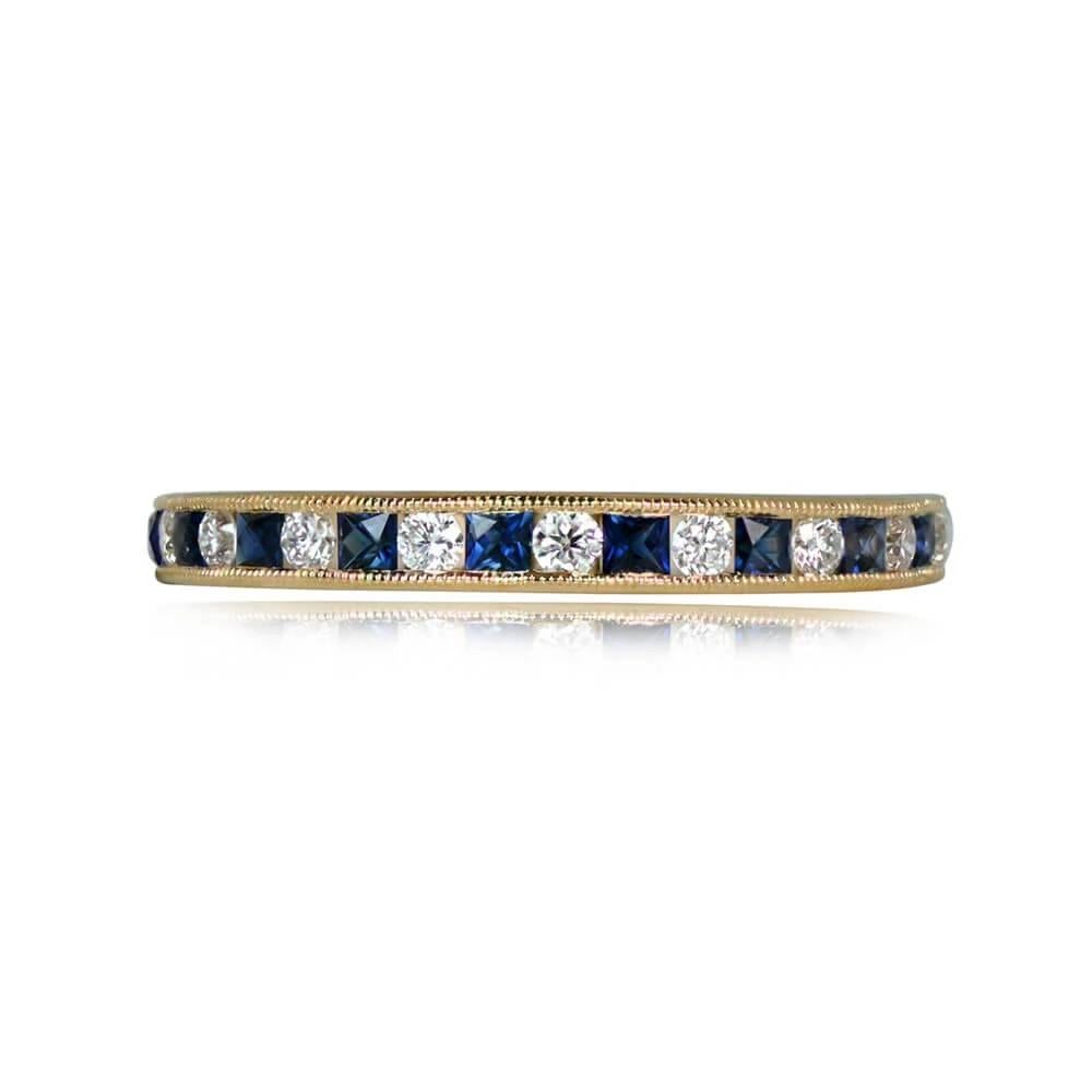 A charming half-eternity band in 18k yellow gold, showcasing 0.31 carats of French-cut sapphires and 0.19 carats of round brilliant-cut diamonds. The gems are set in an alternating pattern with a channel setting bordered by delicate fine milgrain