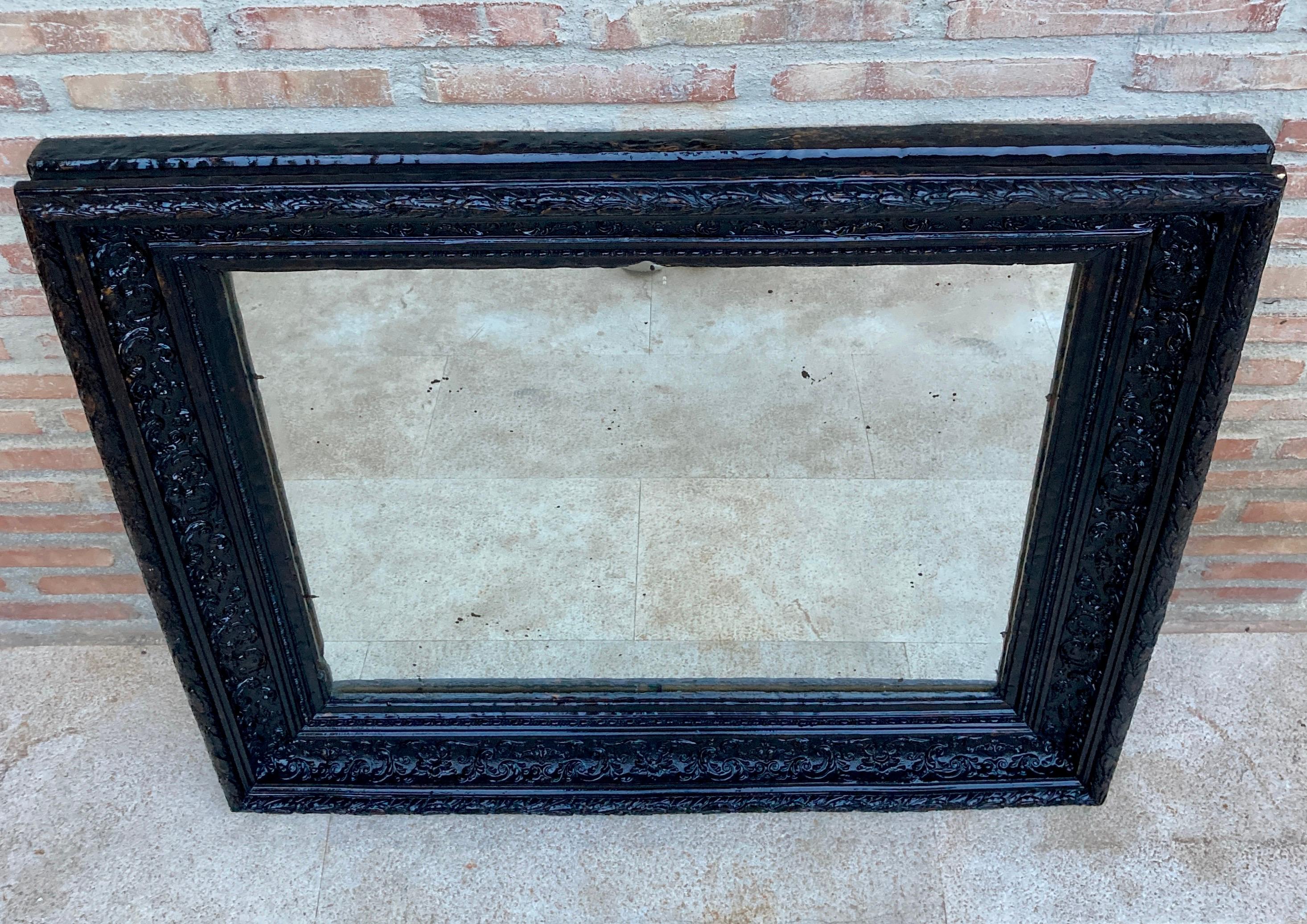 Spanish French Dark Framed Carved Wood Wall Mirror, 1920 For Sale