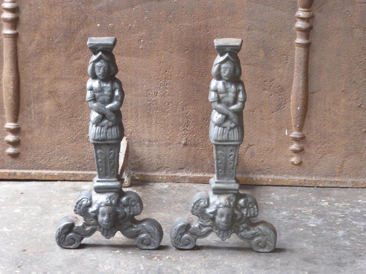 20th century French D'Artagnan firedogs made of cast iron. D'Artagnan is the best known hero of the three Musketeers.