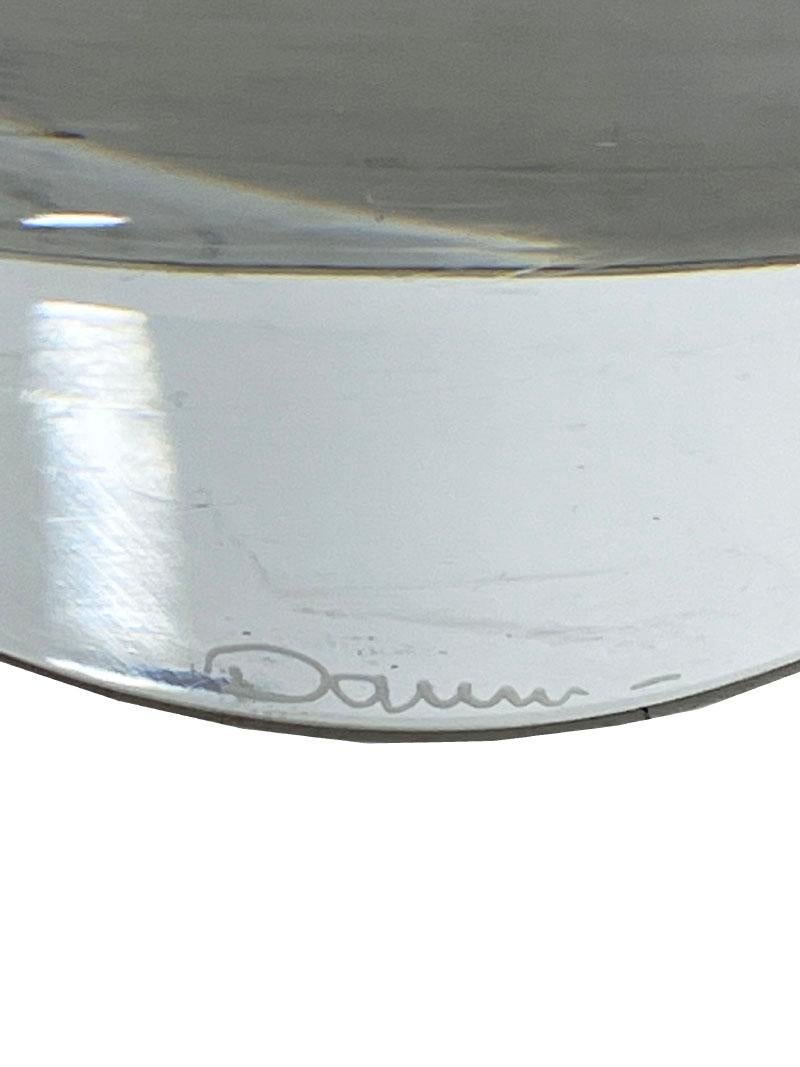 A crystal table lamp by Daum, France, 1970s. A transparent crystal lamp with a 3 dimensional effect. Hollowly worked inwards, so that it gives a beautiful effect at the front.
Signed on the front of the foot. The lamp is semicircular and tapers