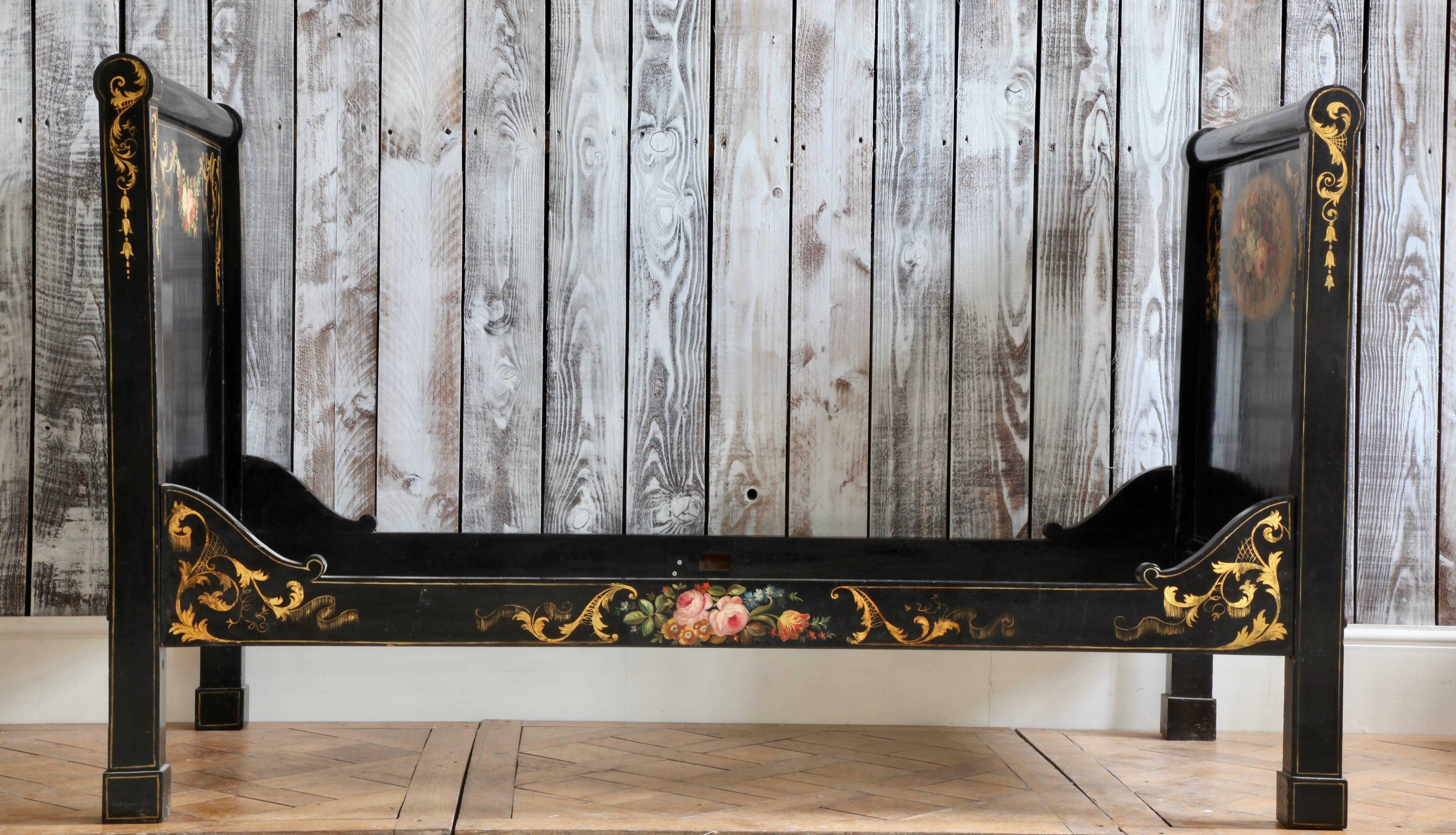Hand-painted daybed, French, 19th century.

Mattress size: 2ft6 x 5ft9' or 76 x 176cm

Beautiful hand-painted wood panels in vivid colors on a black lacquer background. Neat size, for a child's room or as a sofa/bed where space is a