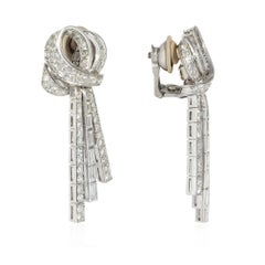 French day-to-night diamond loop and tassel earrings