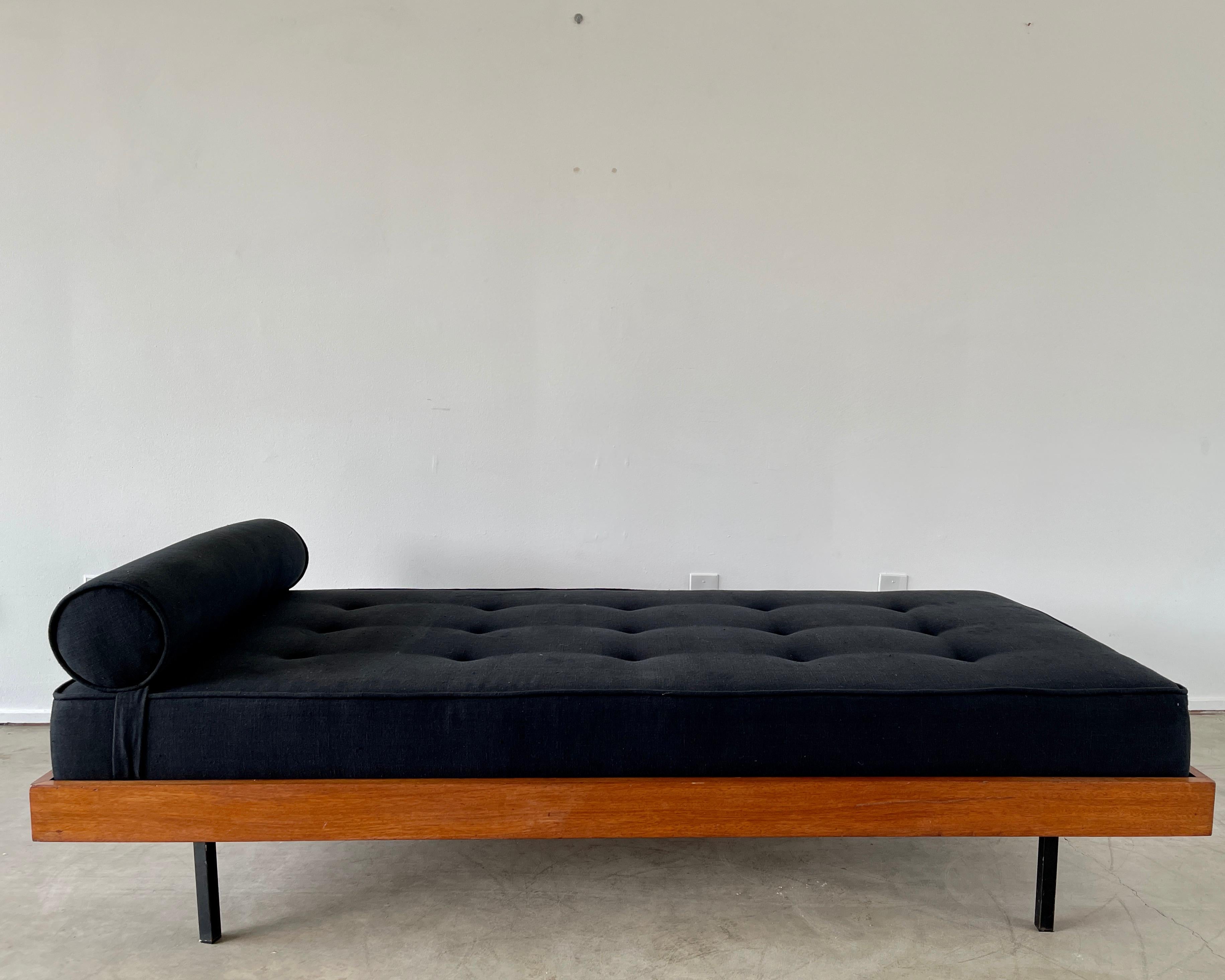 1950's French daybed with mahogany wood frame, iron legs and new black linen upholstery. 
Simple Classic design.