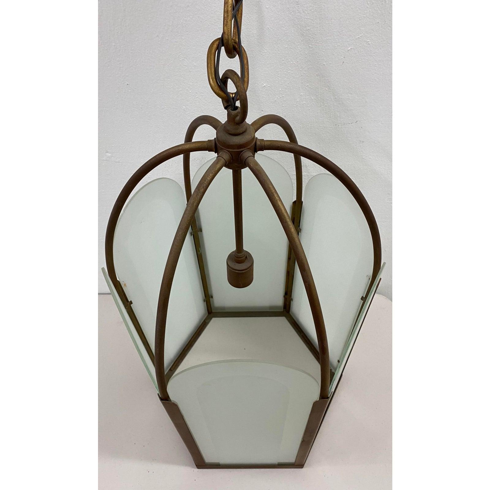 French Deco bronze & frosted glass single light hexagon pendant chandelier, circa 1920

Gorgeous pendant light. Six sides. Each frosted glass panels lifts up, making changing the bulb easy.

Comes with the original chain and canopy.

The lamp