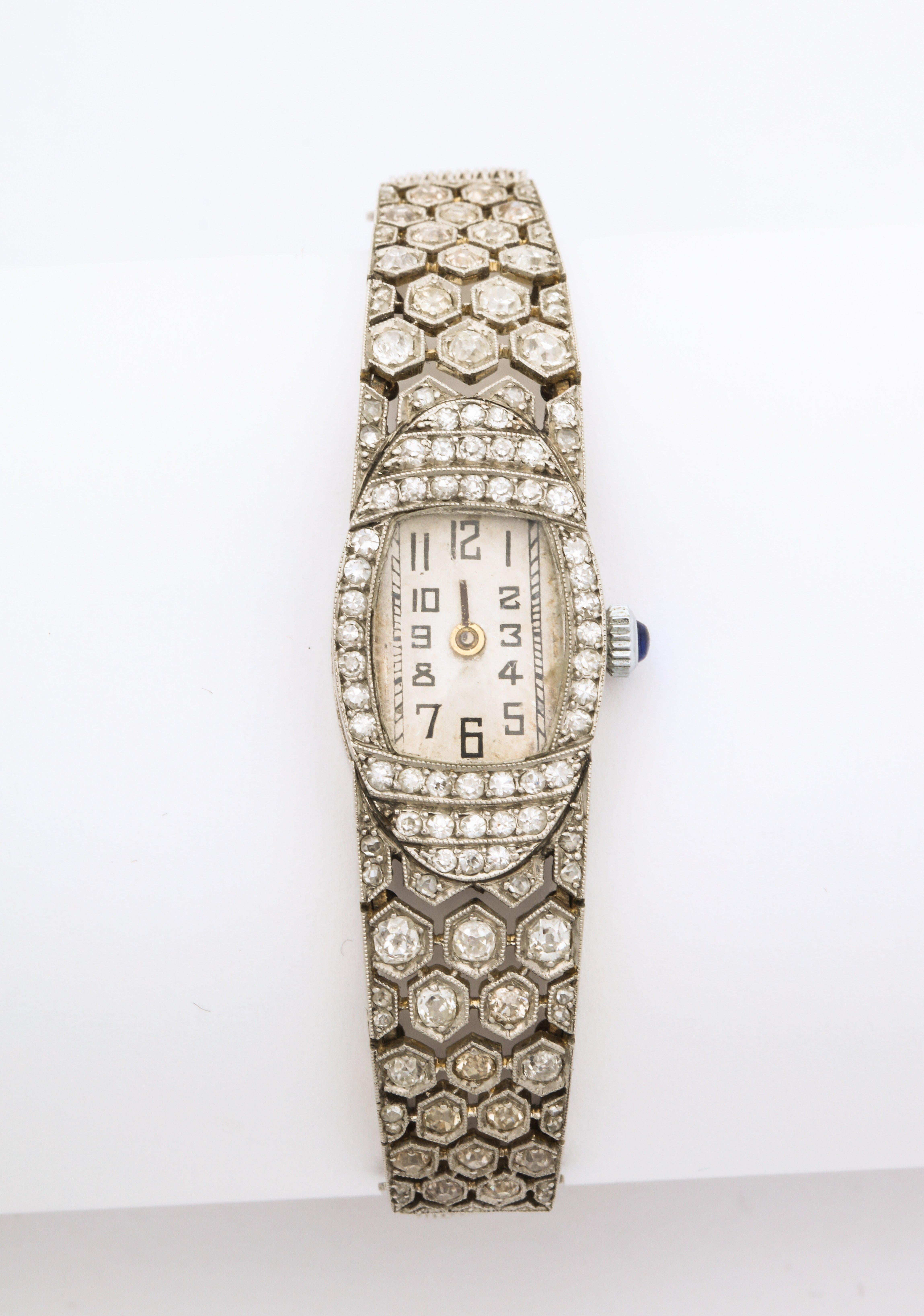 A wonderful French Deco Diamond Honeycomb Design Platinum Watch. With replaced movement