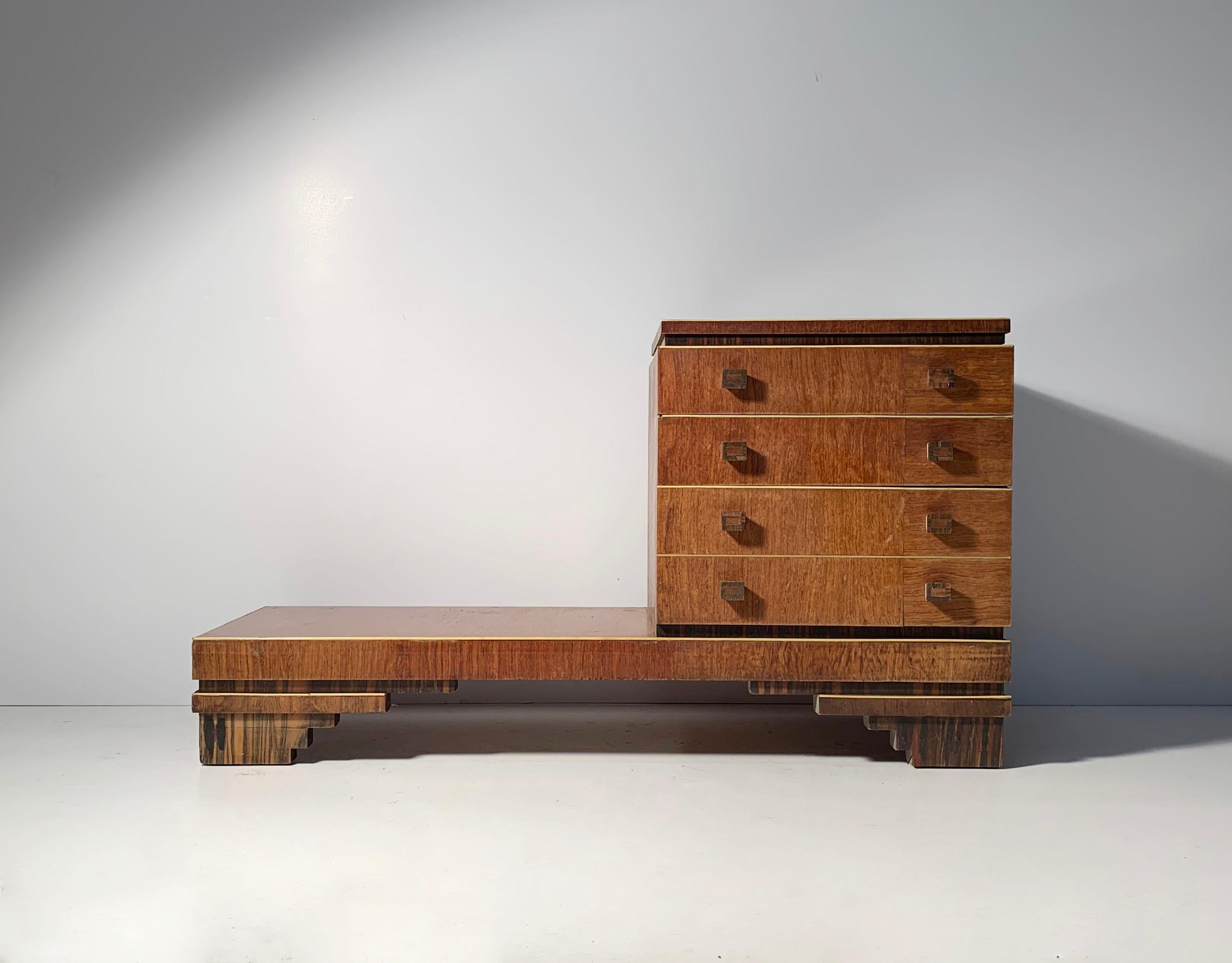 Deco vanity mirror with chest of drawers. Use of exotic woods on a deco skyscraper base. The handles are 2 types of wood. No markings or labels. Appears to be of French origin. An early piece that shows some age with loss of veneer and some of the