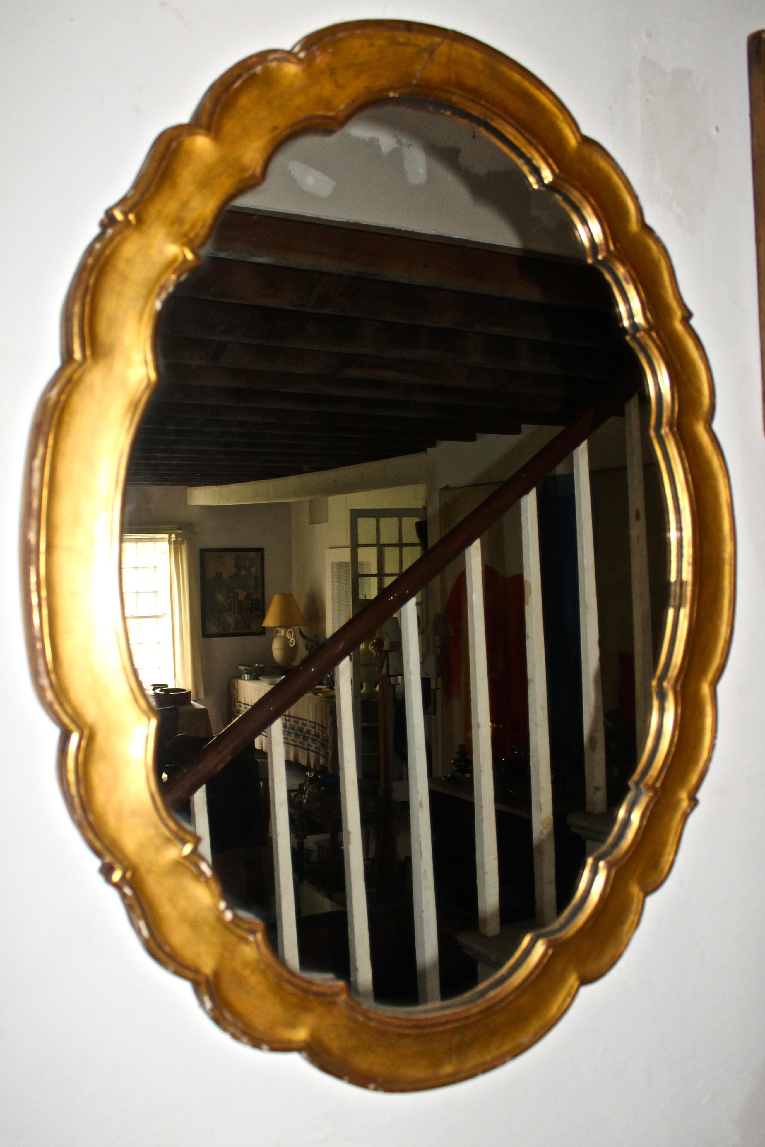 Gilt wood vertical oval with Wiener Werkstatte style to French 1950s style decorative detailing.