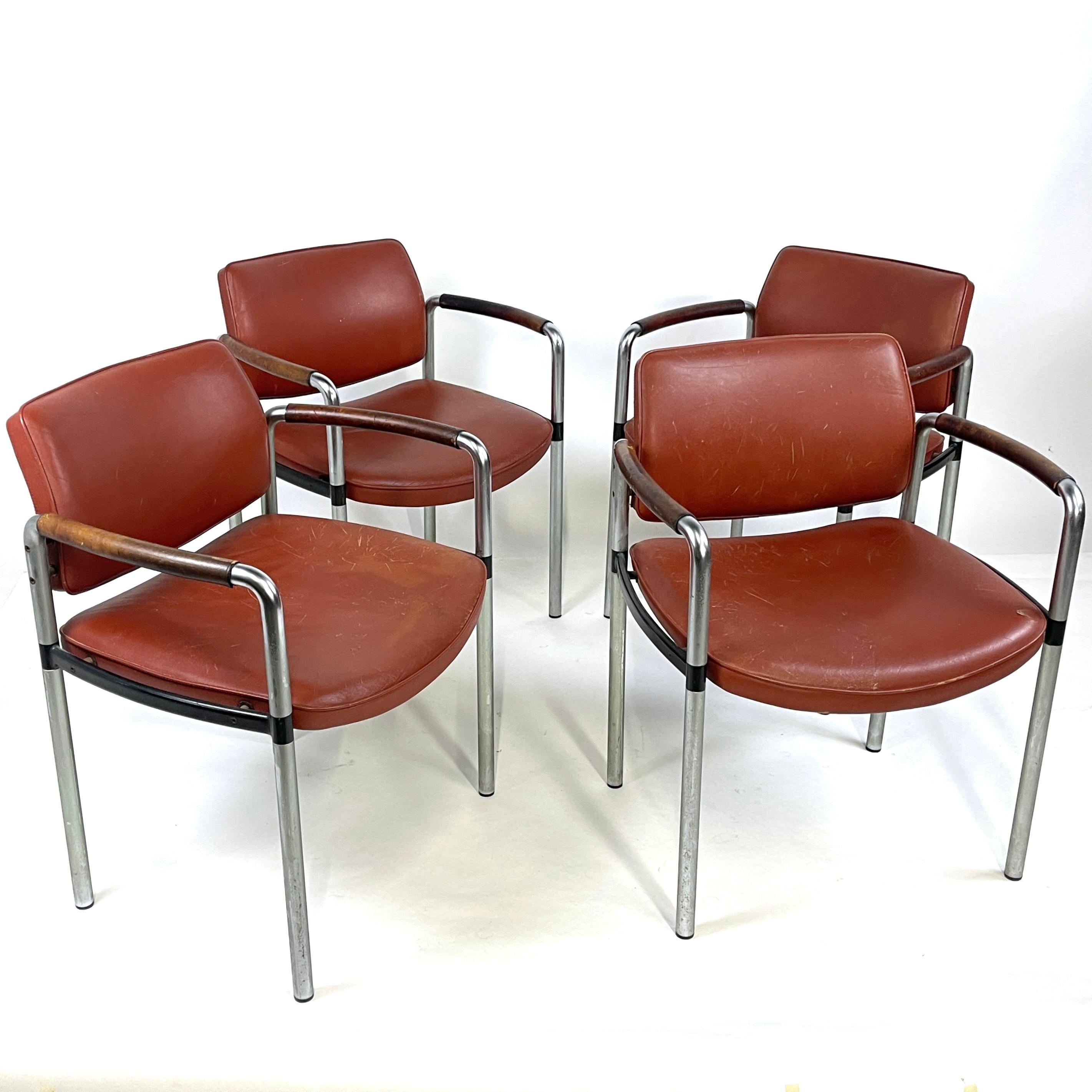 Very heavy chairs. Stunning French Modernist chairs with a beautifully patinated leather arm detail. Solid steel frames with solid black metal detail on the frame. 
These chairs are from France- maker unknown. The quality and heft are remarkable.