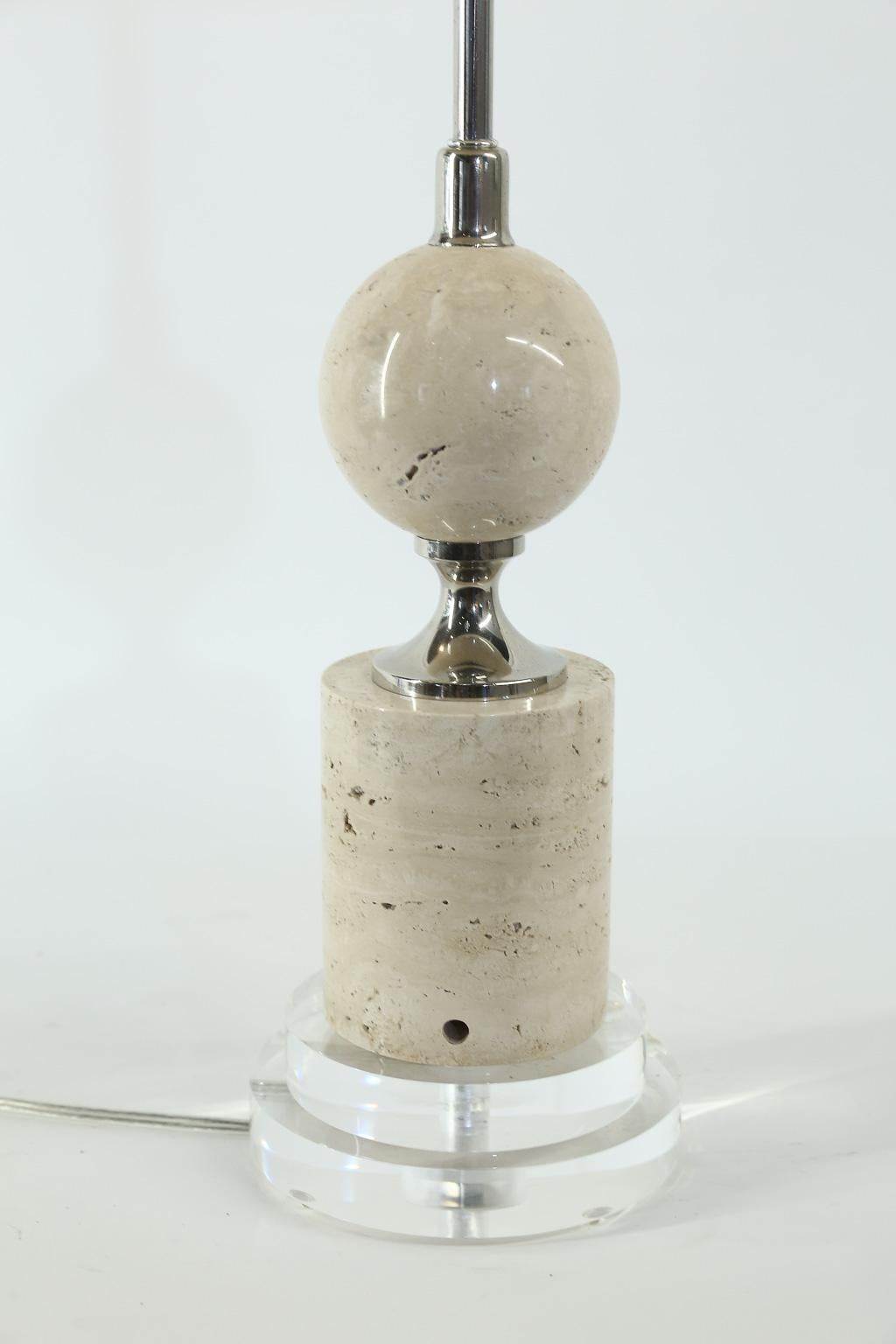 This is a newly restored and wired midcentury French table lamp. Made of travertine, chrome and acrylic, this piece will add the Mid-Century Modern touch to any room. The shade is included and measures 14 inches in diameter and 10 inches high.