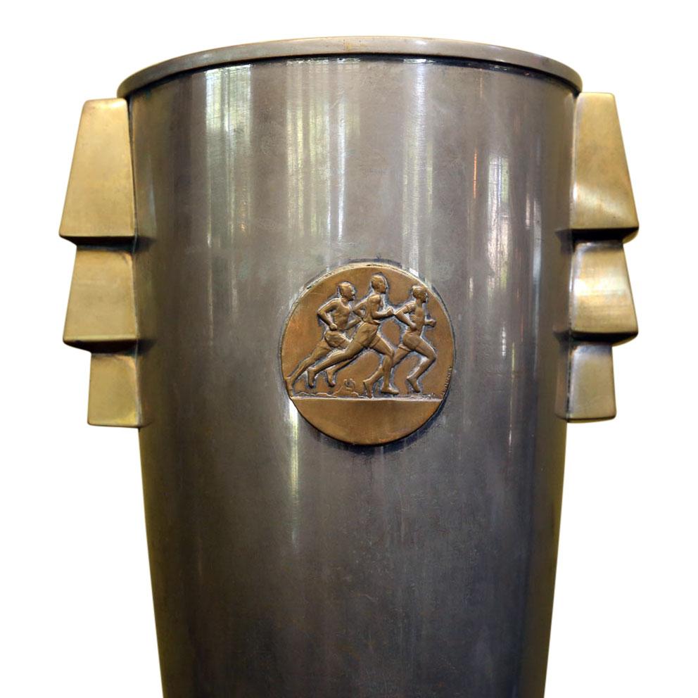 French Art Deco trophy cup (circa 1925-1940). Nickel over copper mounted on honed stone base. All original with bold shape and exquisite naturally worn patina. Extremely decorative.