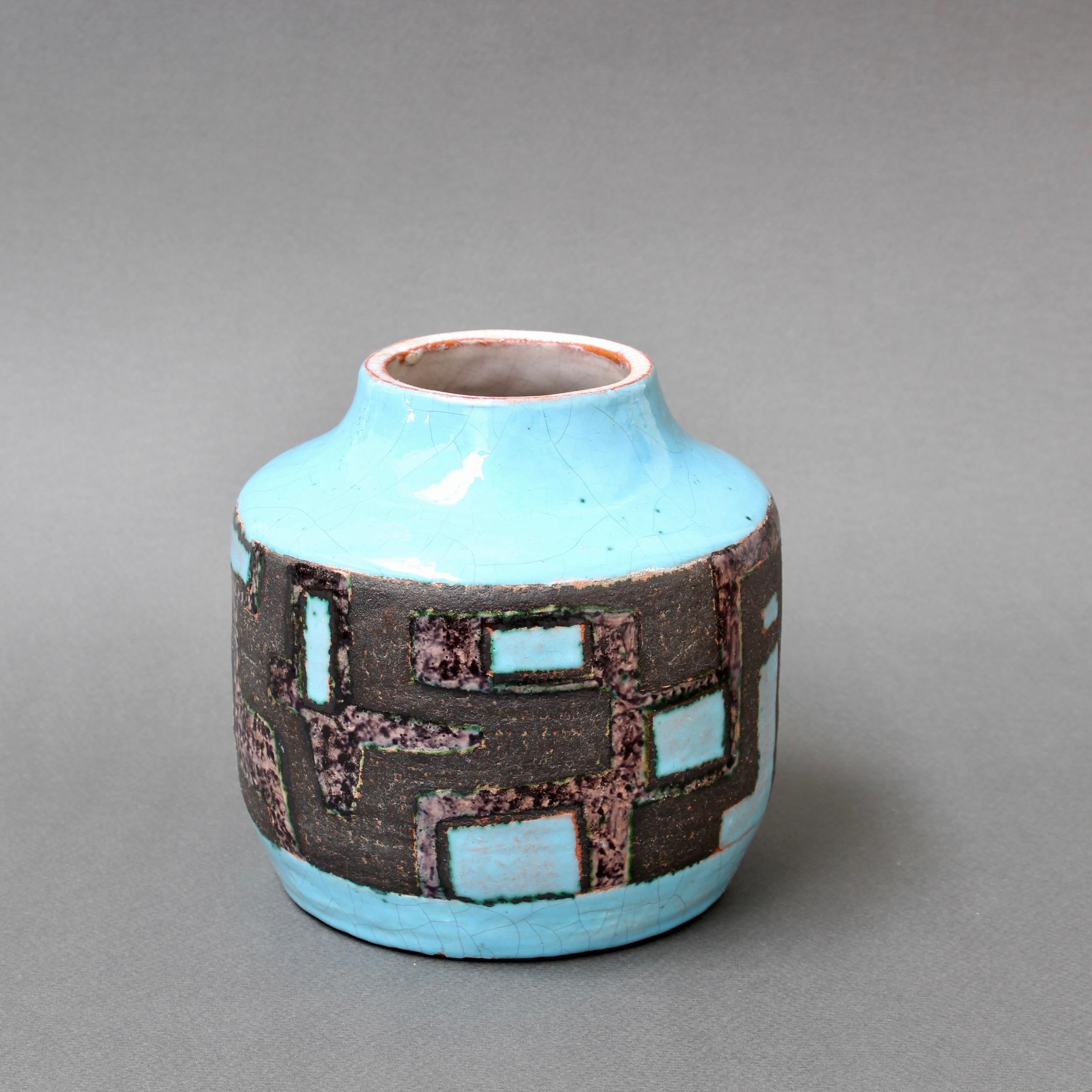 French decorative ceramic vase by Jean-Claude Courjault (1961). A diminutive piece with a narrow mouth and vibrant colour sets this beautiful vase apart from his other, more usual, darker works. The piece was created with a delicate sky blue enamel