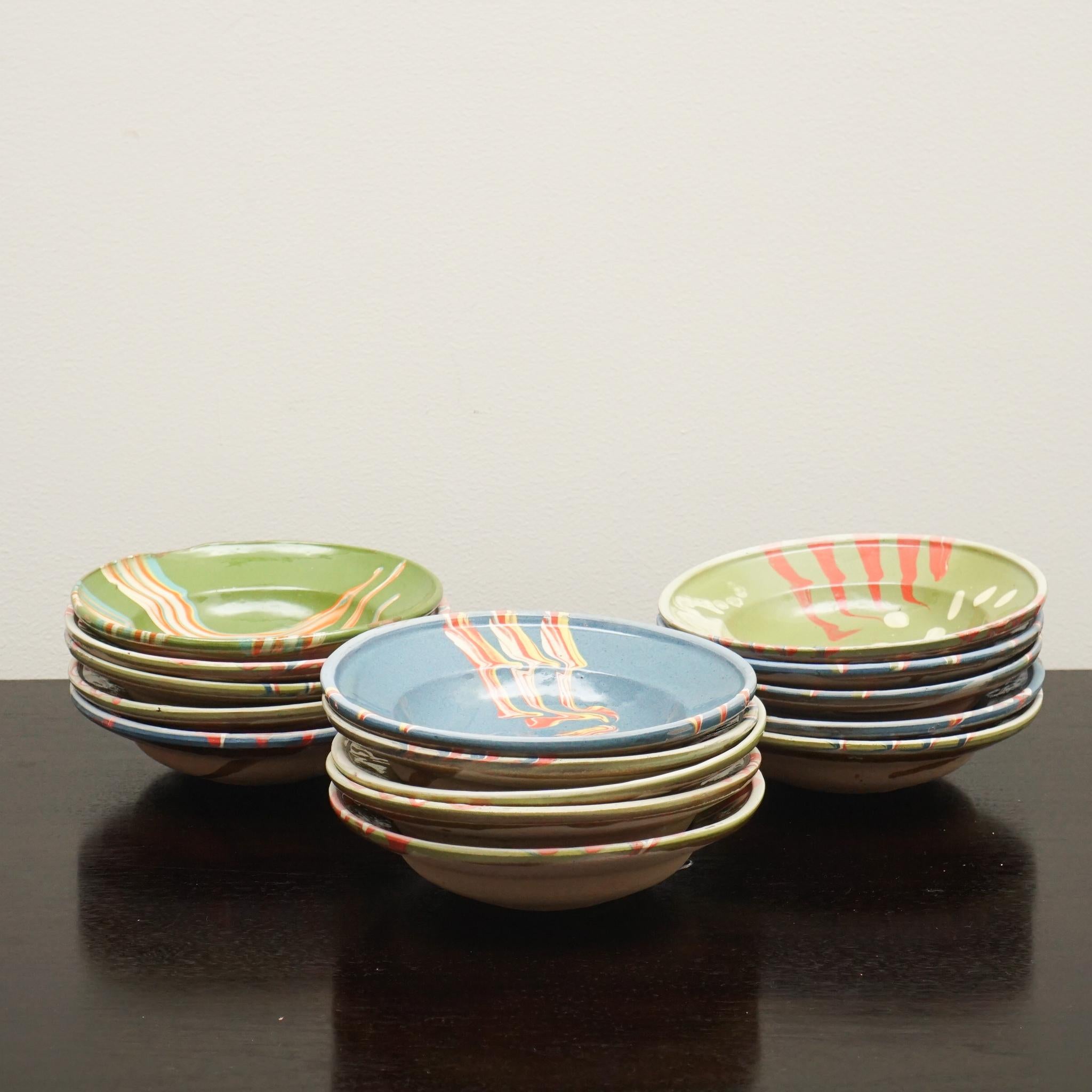 These delightful decorative clay bowls were discovered on a recent buying trip in France.  The bowls are hand-glazed in a variety of colorful patterns on a ground color of either green or blue.  There are fifteen bowls to choose from and many have