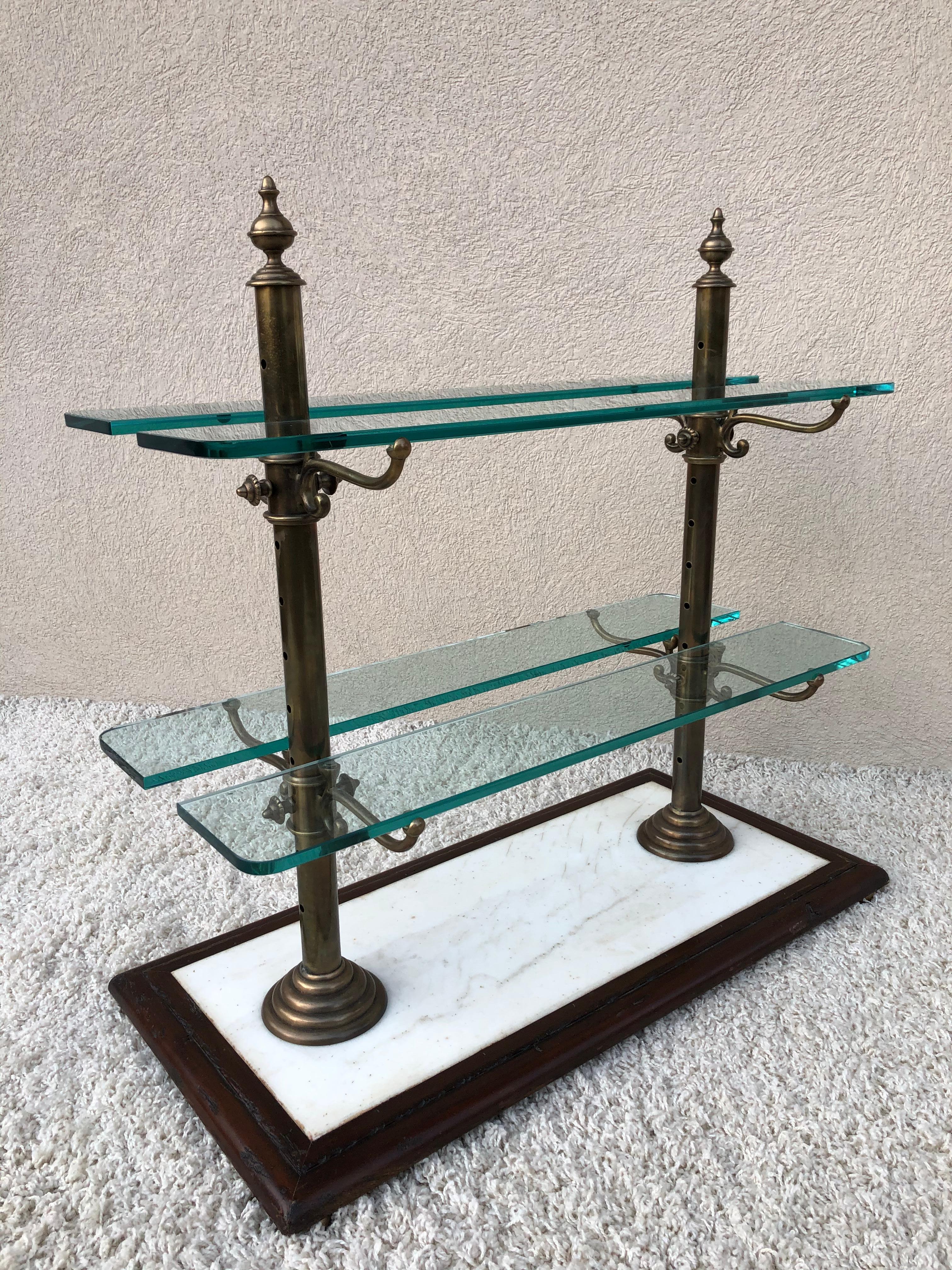 French vintage reproduction brass with bronze patina, marble wood and thick glass shelves pastry stand, very heavy not sure of the age, two slight scratches to one glass shelf. Otherwise wonderful antique look and style.
 
