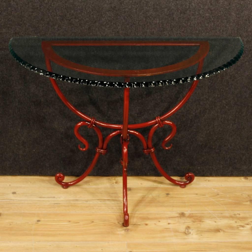 French console table of the second half of the 20th century. Demilune furniture in painted metal and glass top of a beautiful decoration. Console of excellent proportion, it can be easily inserted in different parts of the house. Solid and stabile