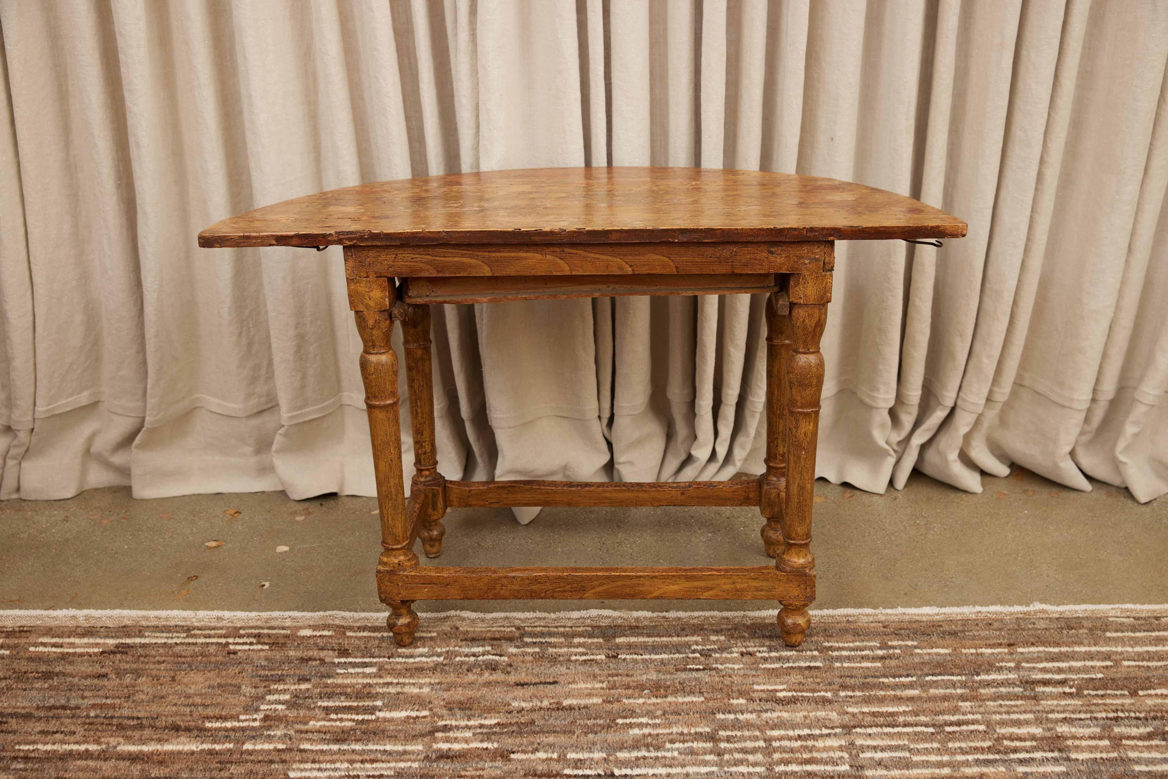 French Demilune Table 19th Century
Discover the elegance of historical craftsmanship with this early 19th-century oak work table. Exuding timeless appeal, this piece features beautifully turned legs that demonstrate the artisan's skill and attention