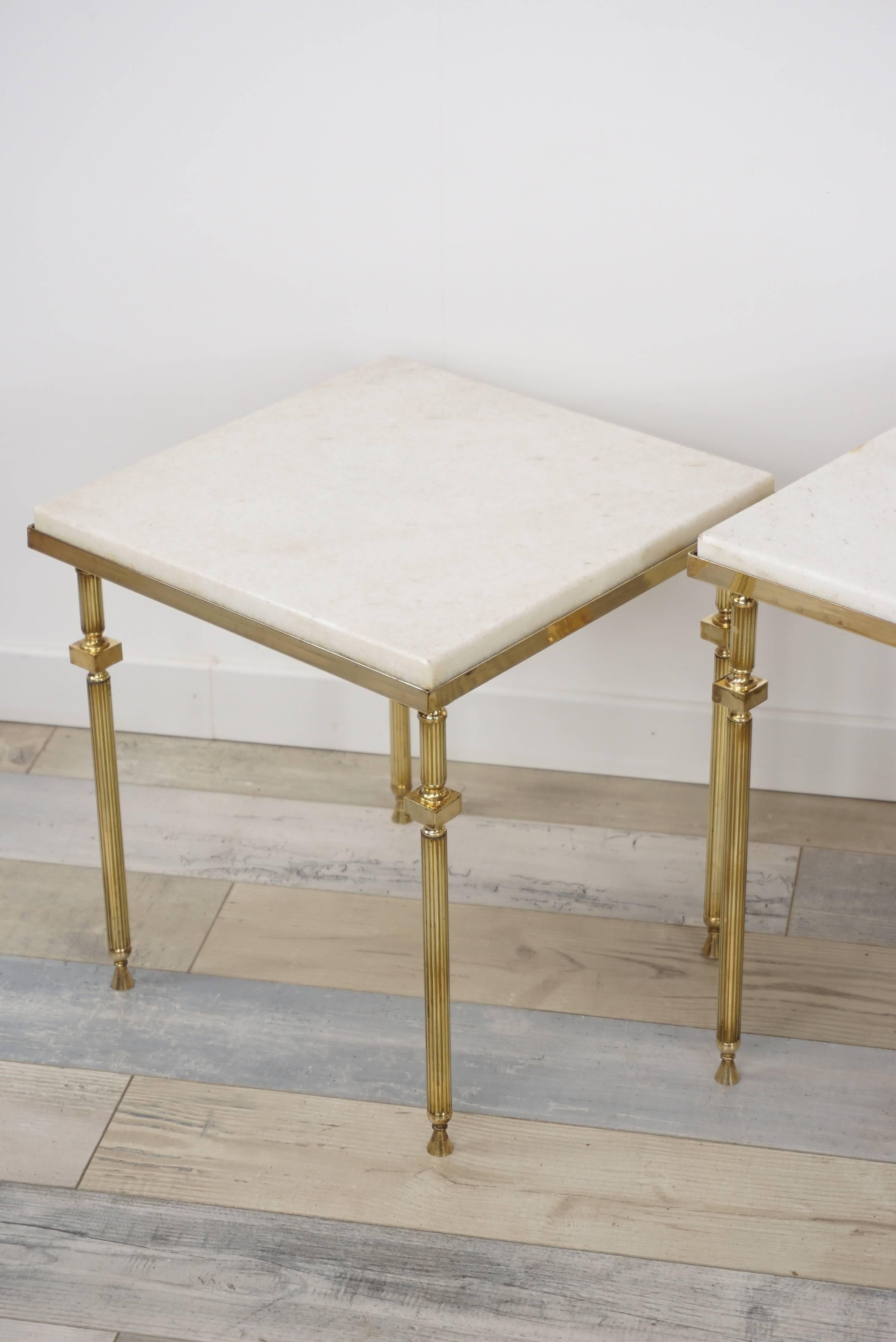 Brass and white marble set of nesting tables attributed to Maison Baguès (measure: H 44cm/ W 54.5cm/ D 39.5cm – H 40cm/ W 45.5cm/ D 36.5cm – H 37cm/ W 35.5cm/D 34.5cm).