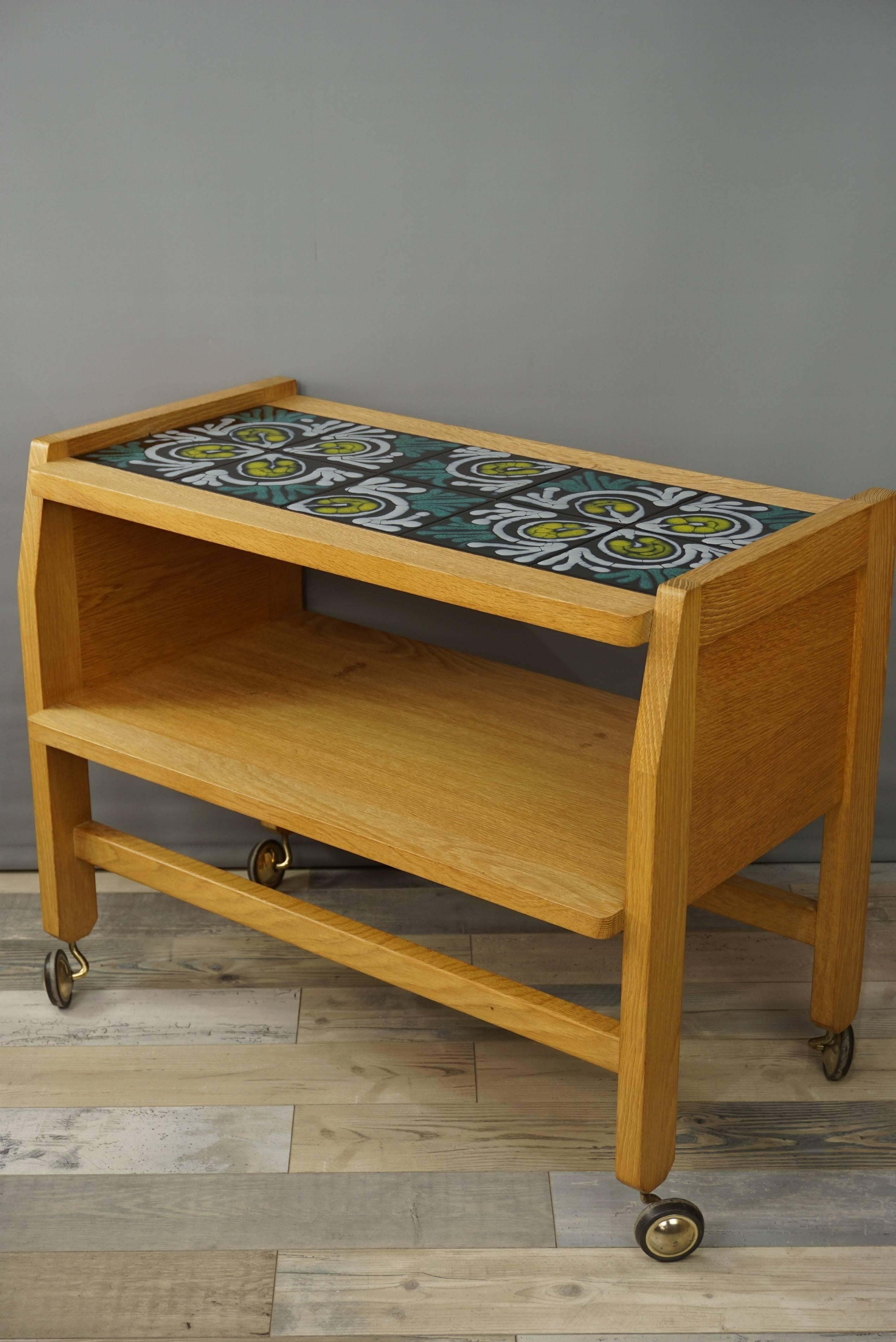 Light solid wood and patterned Boleslaw Danikowski's ceramic for this 1960s service table by Guillerme and Chambron (the famous North of France designer trio from the 1950s-1970s) for Votre Maison.