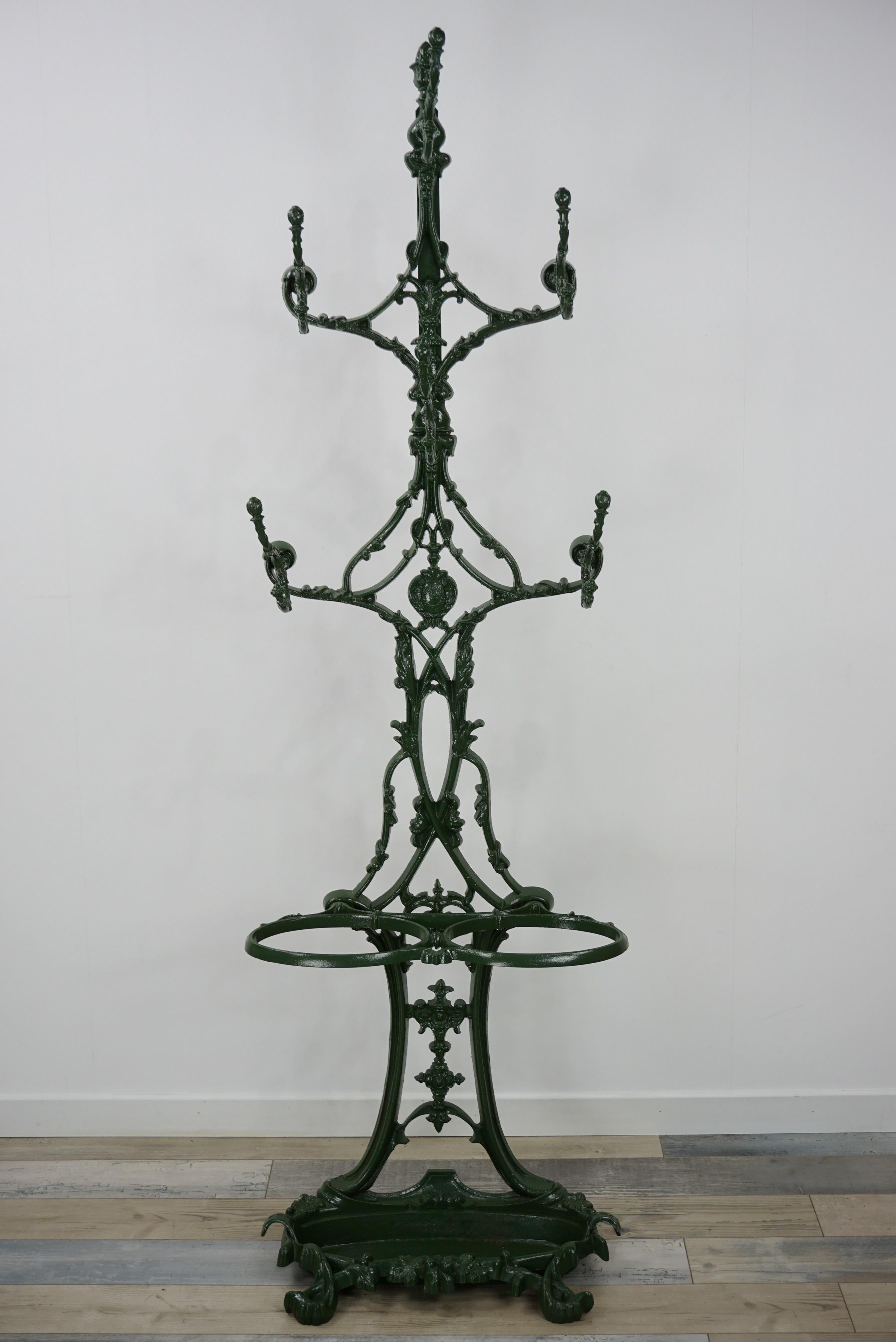 Amazing French antique coat rack by Alfred Corneau in dark green colored.