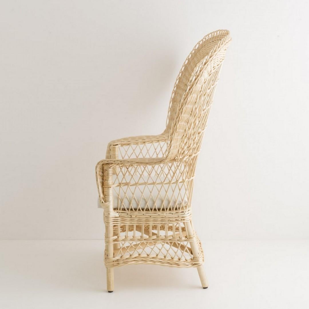 Sculptural and gorgeous Emmanuelle style blond wicker French 1970s design armchair. Handcrafted and handbraided, it is a Vintage style centerpiece with a Bohemian chic look!.