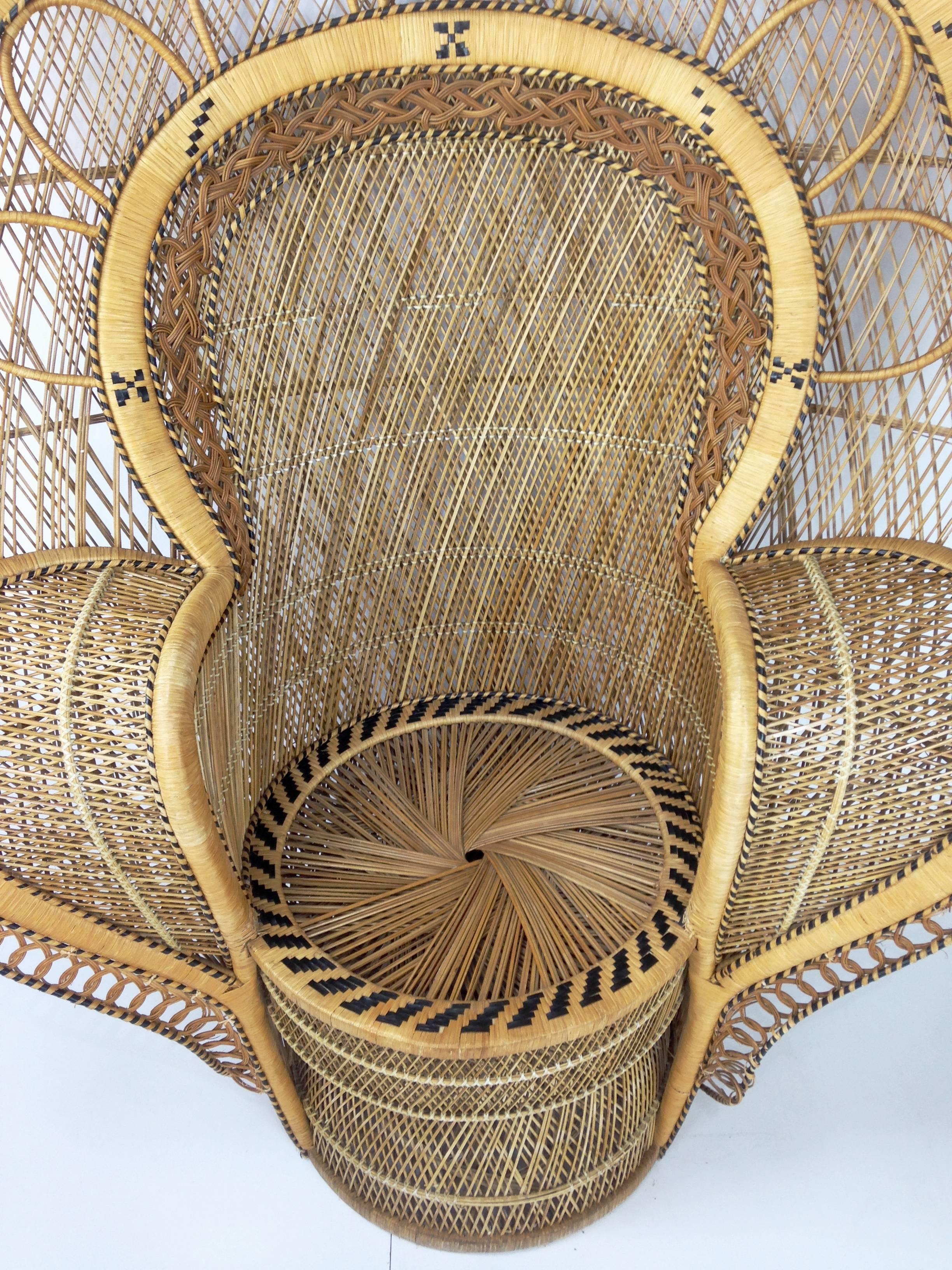Sculptural and monumental (the only one with this scale!) Emmanuelle wicker and French armchair from the 1970s in incredible state of conservation. Vintage style centerpiece with a bohemian chic look!